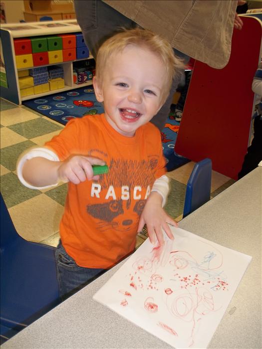 Practicing fine motor skills in the toddler room