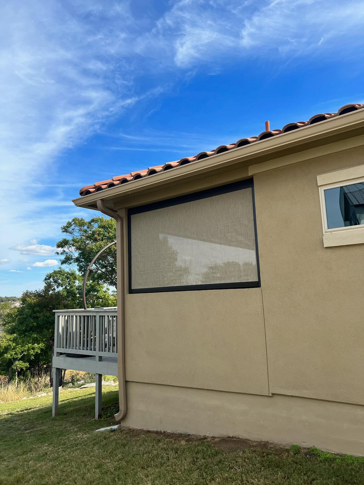 Exterior roller shade for a house in Leander