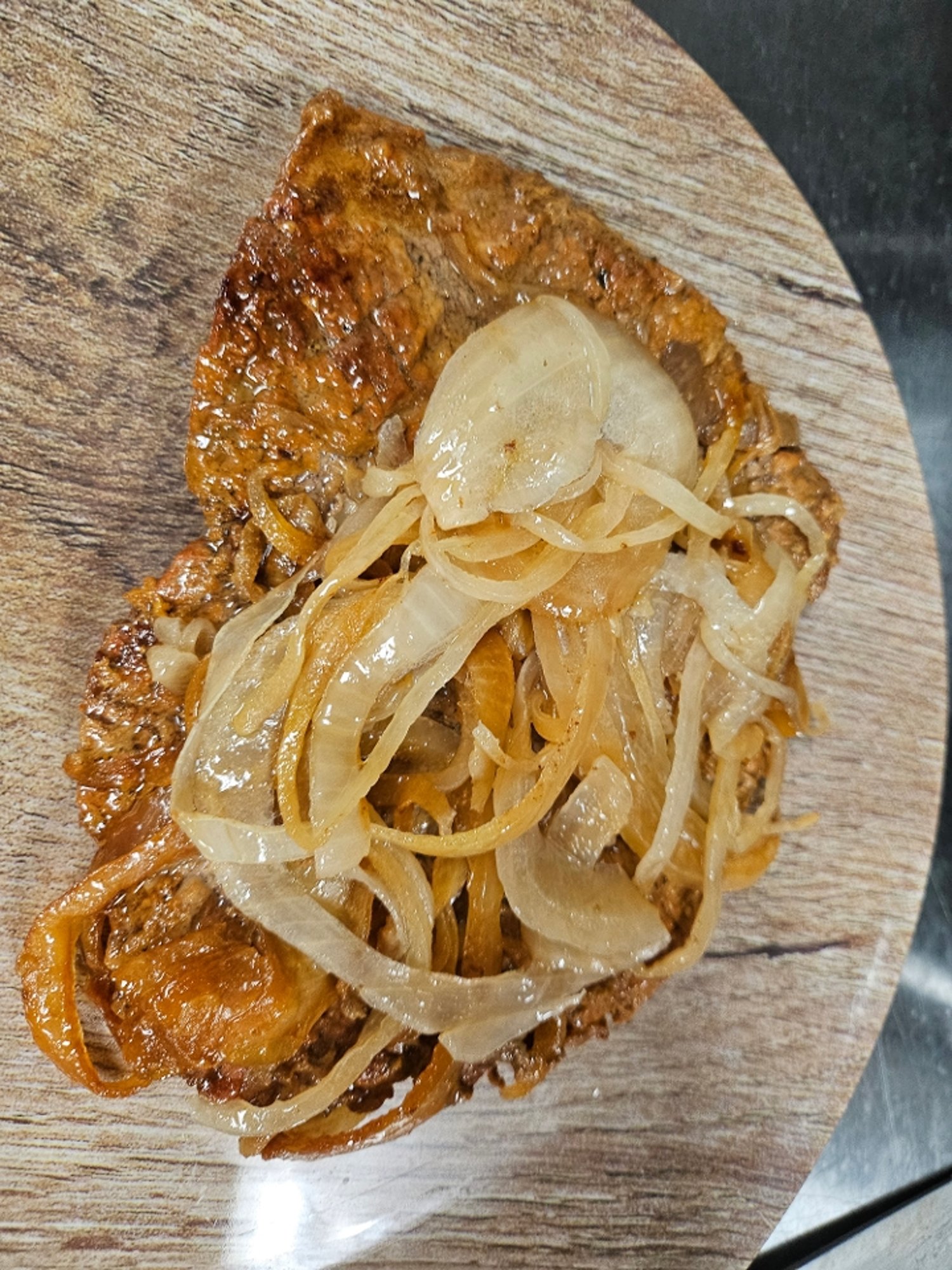 Bistec encebollado/ chopped steak marinated with grilled onions LS
