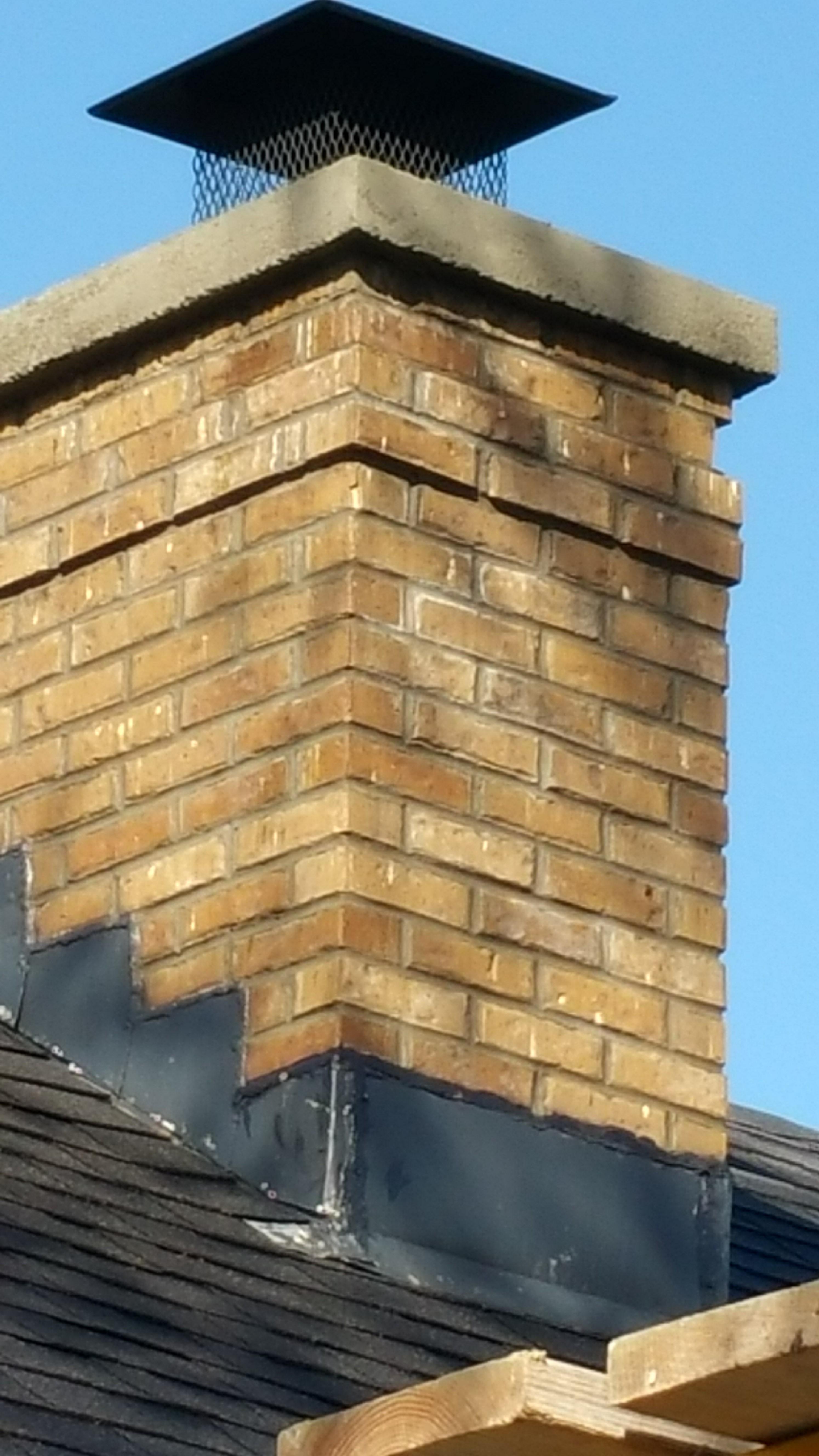 We ground out old mortar, tuck-pointed in new, washed and sealed chimney and added a new crown. 