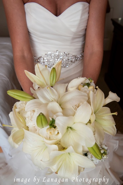 A gorgeous bridal bouquet of white lilies,calla lilies and hydrangea.