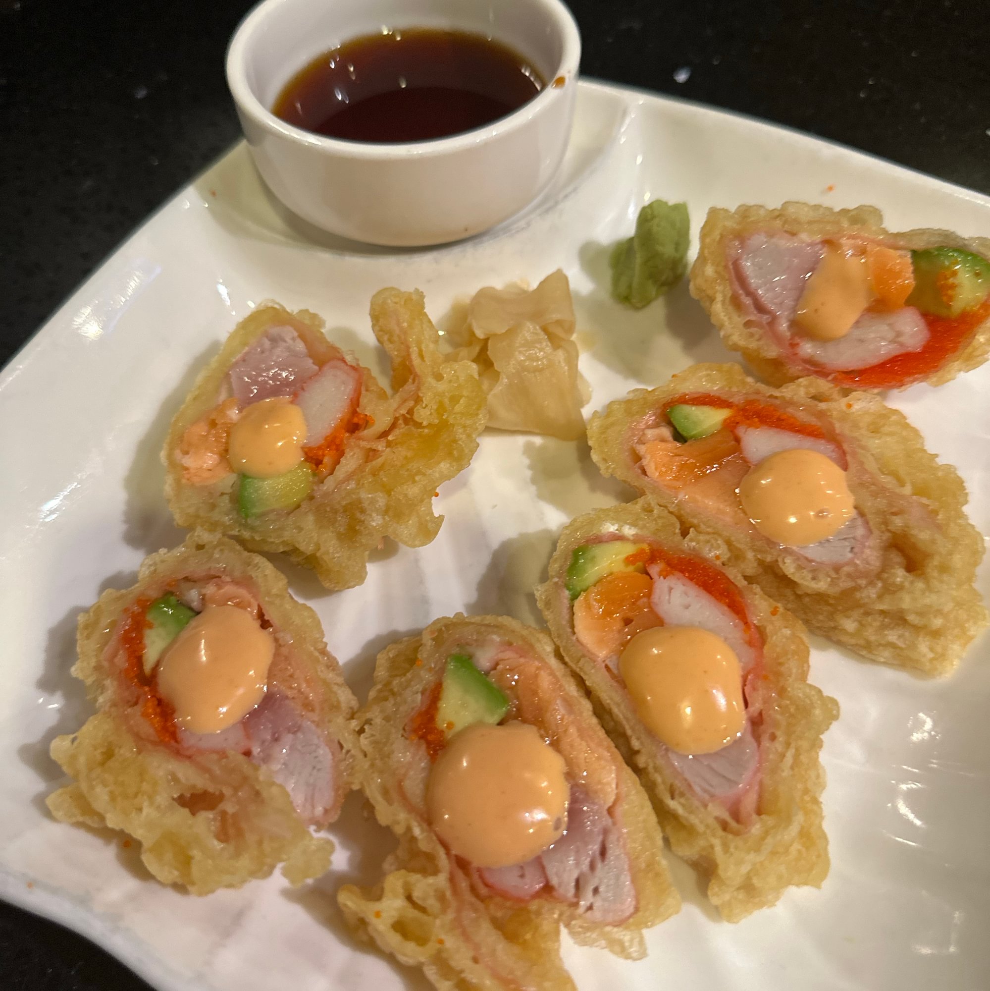 Bird of Paradise - Tuna, salmon, avocado, crab stick and masago rolle…hen lightly tempura fried....