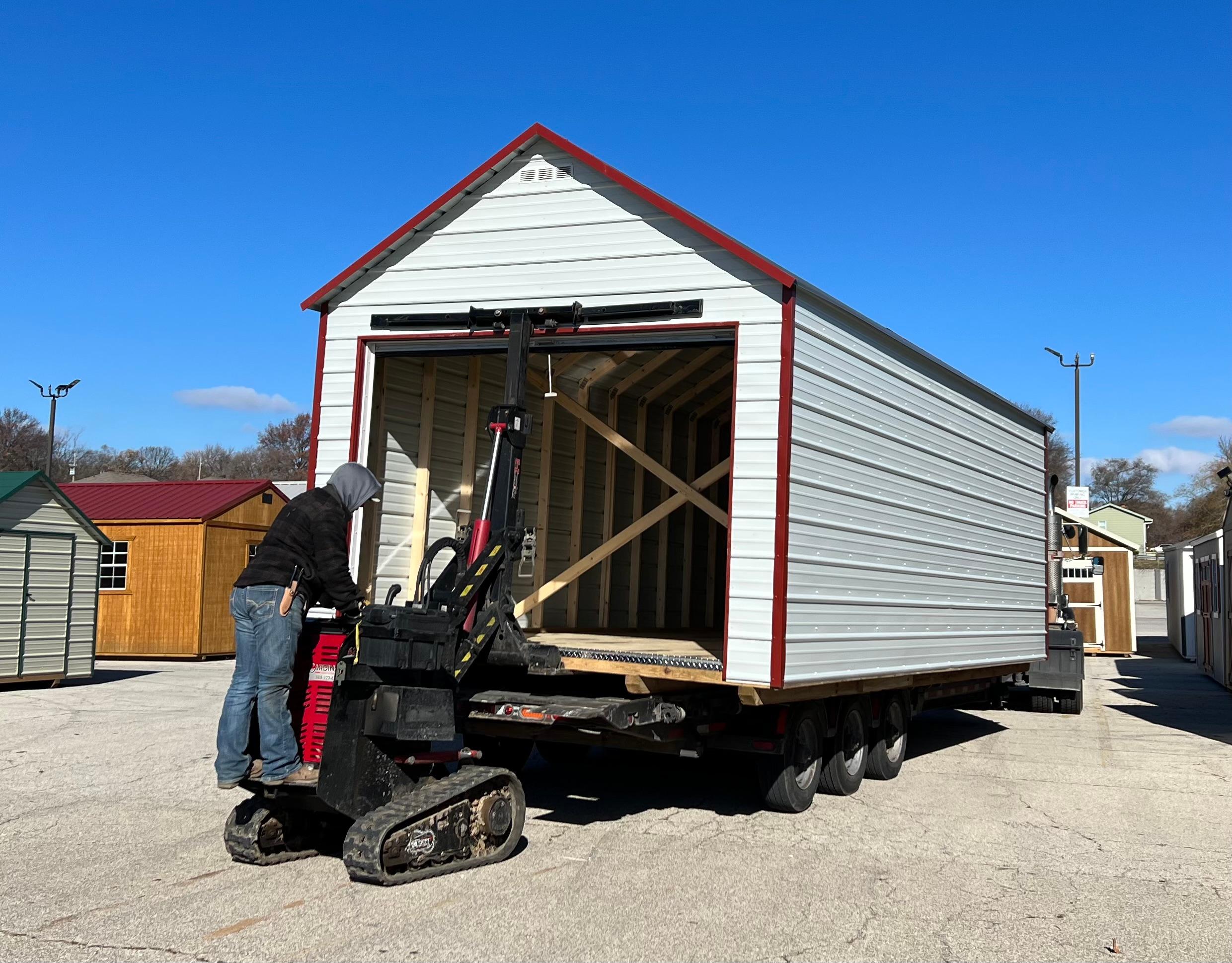Economical value shed prebuilt with roll up door.