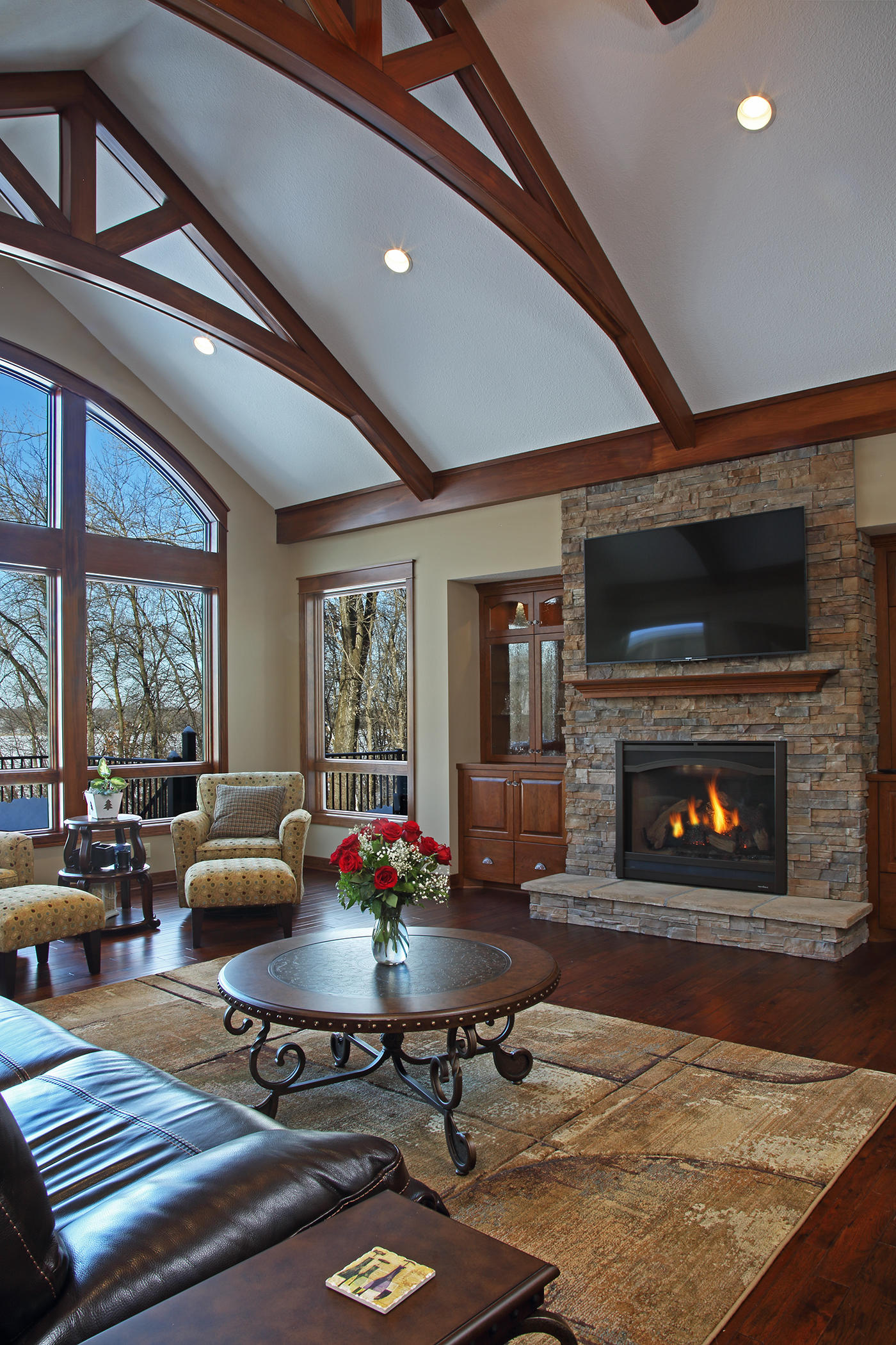 Beamed ceiling and Picture window open this great room