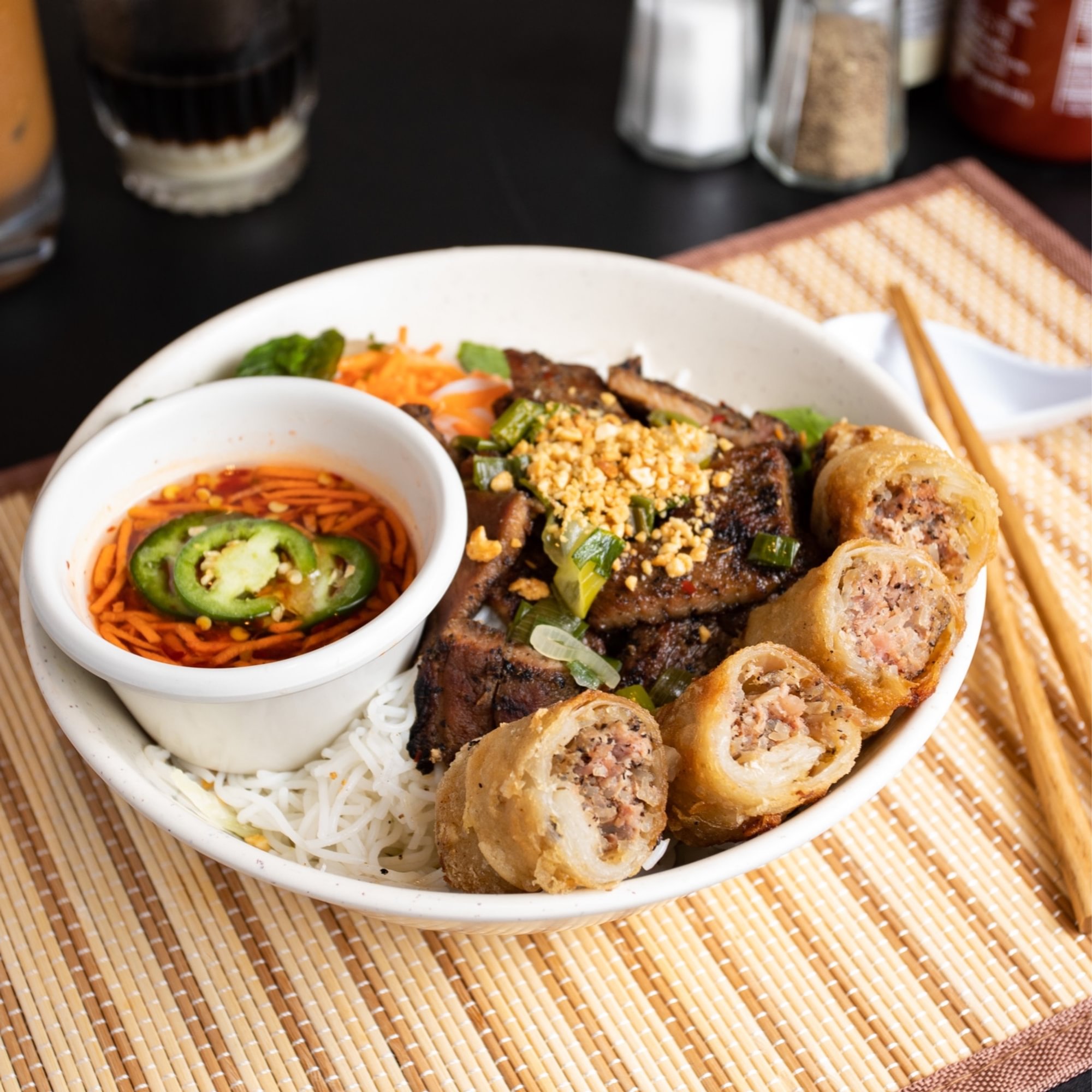 17. Pork shish kebab/imperial rolls over vermicelli - bún chả giò thịt nướng