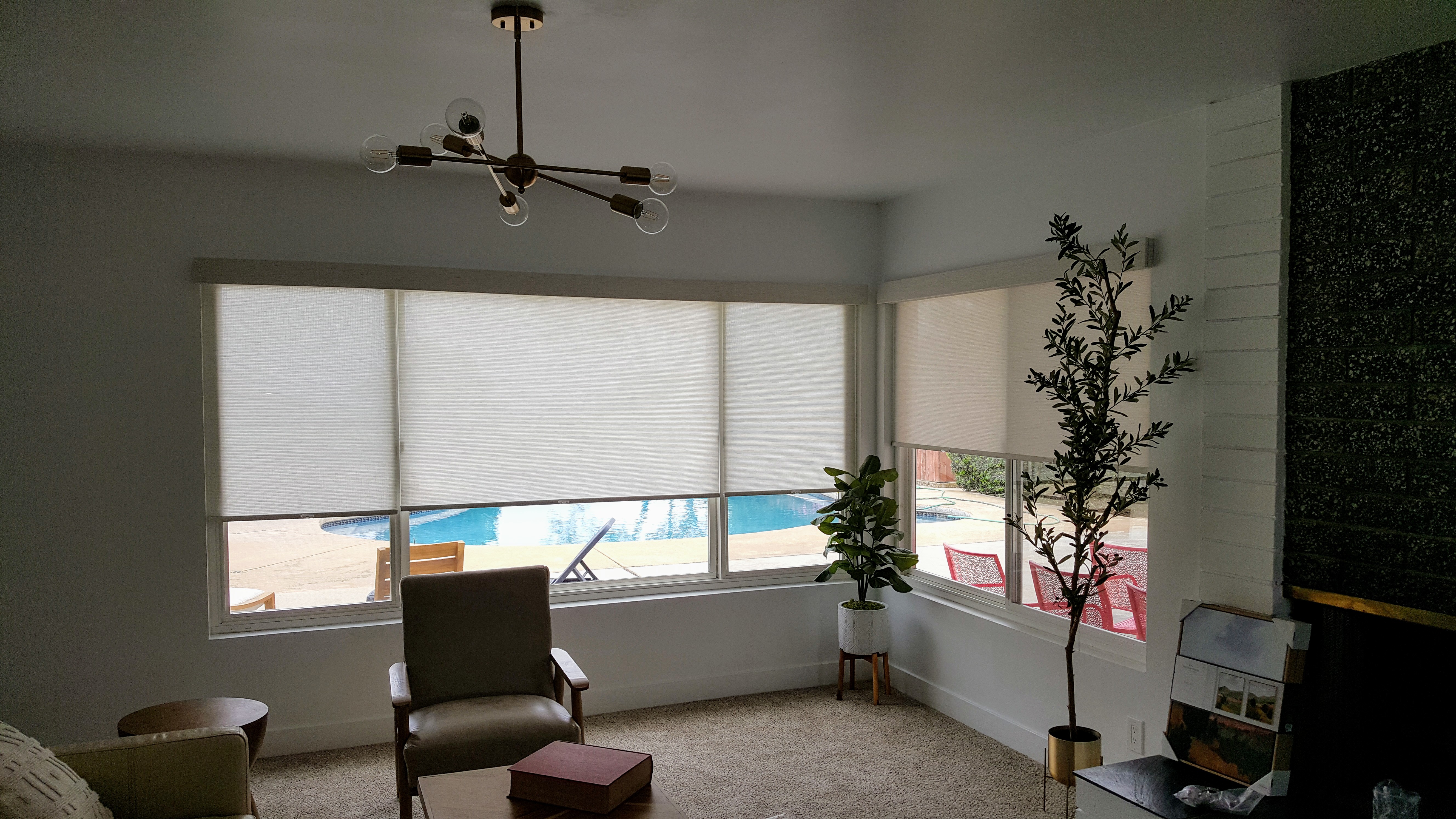 Solar Shades in a corner window with valances in a living room in La Jolla