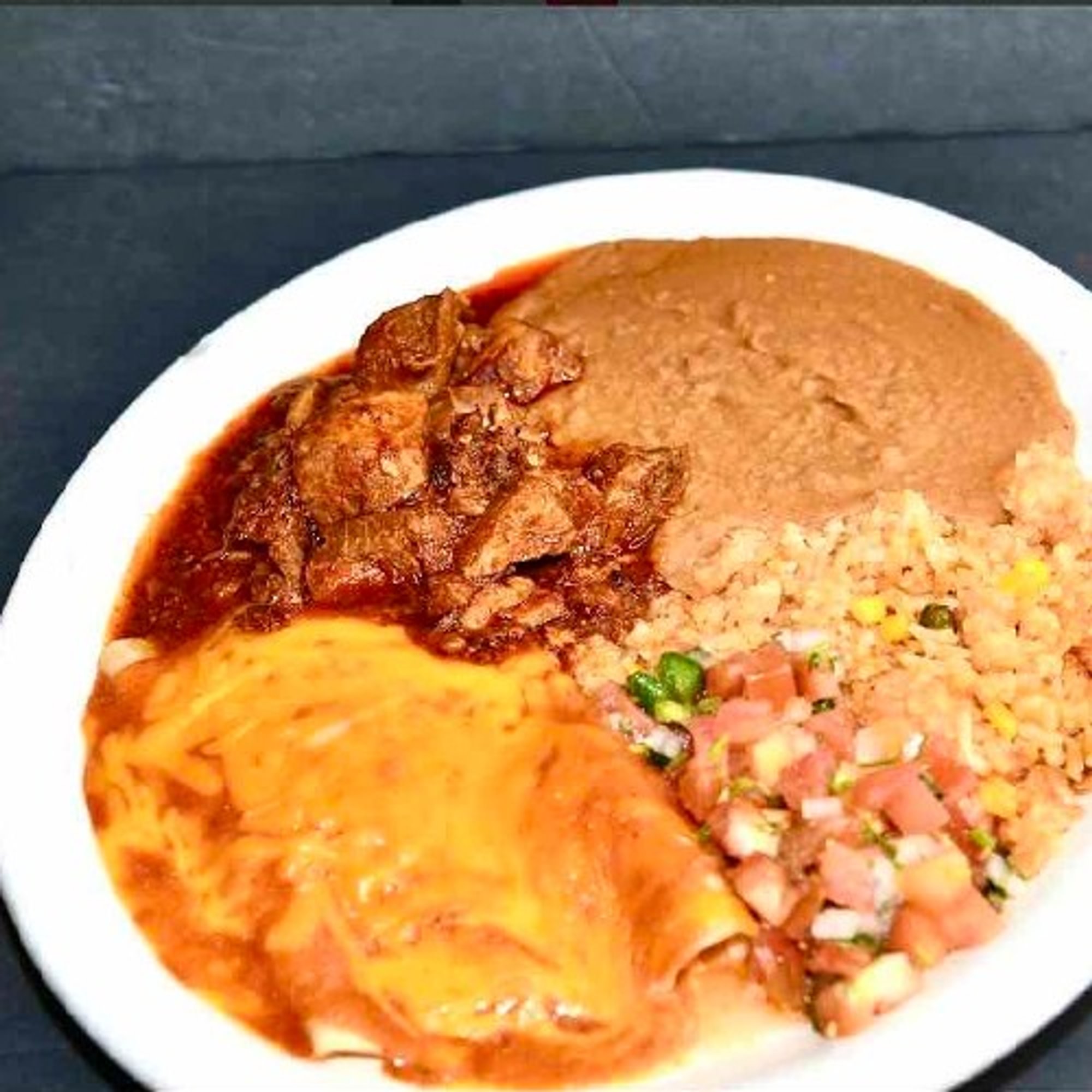 42. 2 Enchiladas, Asado, Spanish Rice, Refried Beans and Pico De Gallo