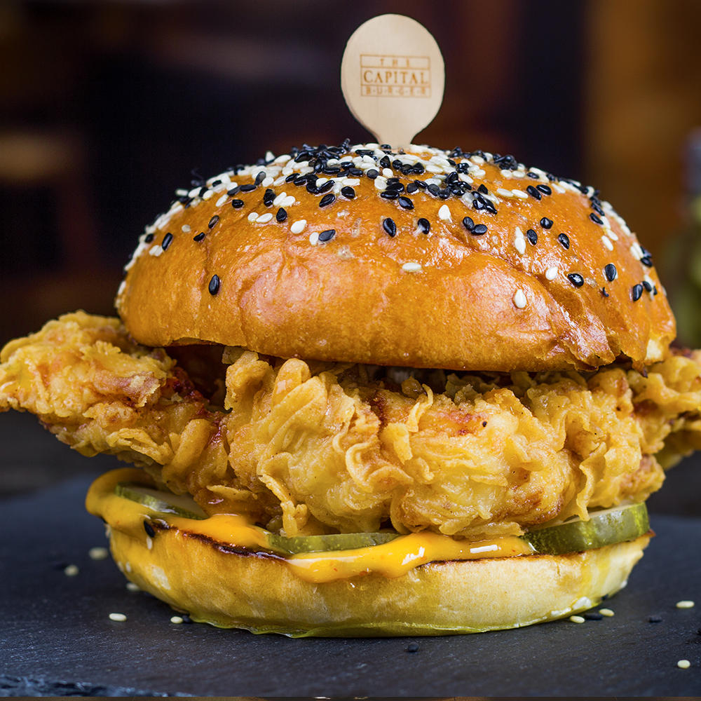 Southern-Styled Fried Chicken Sandwich with Housemade Pickles, Sweet Chile Mayo and Spicy Honey