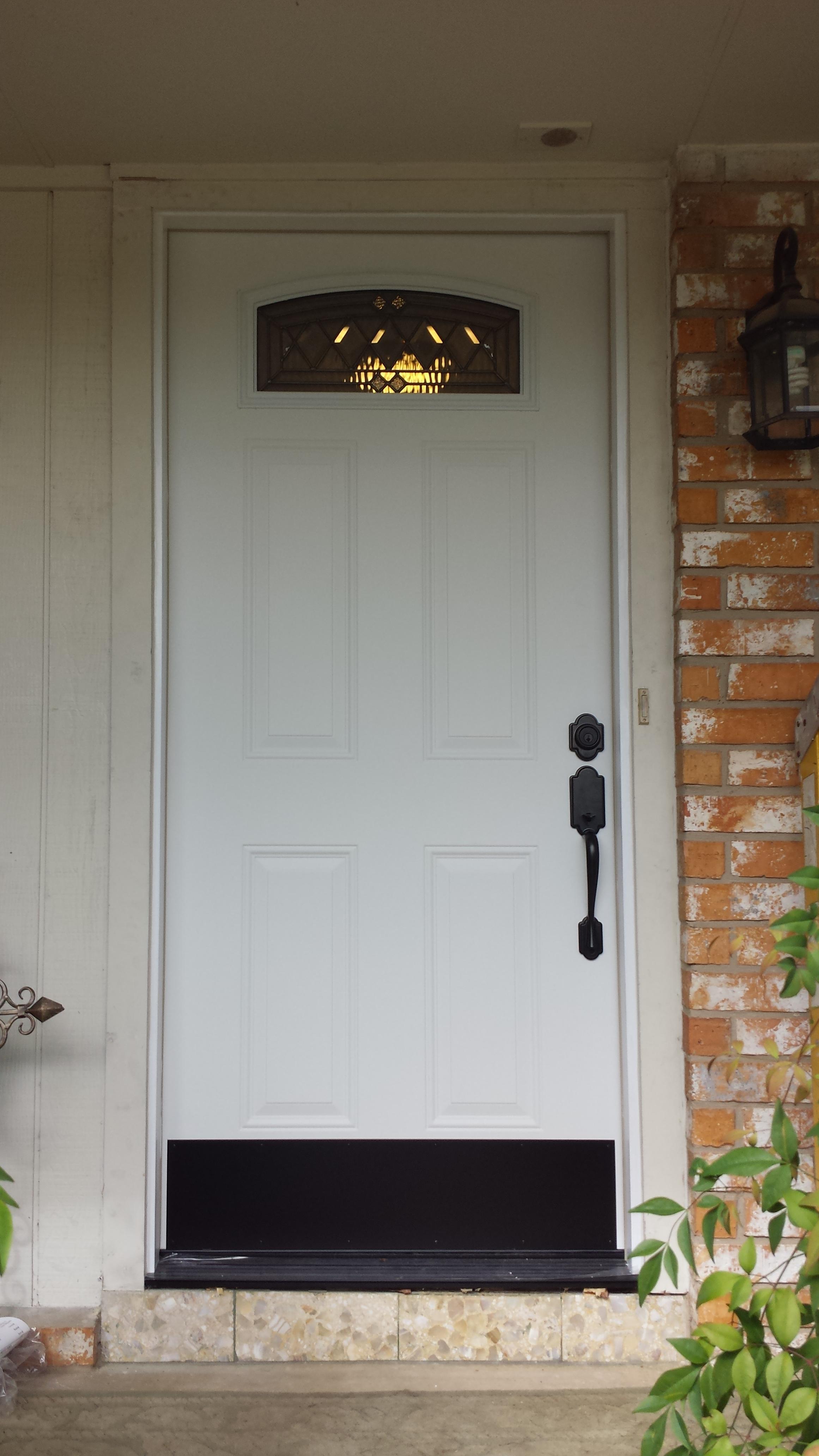 Installation of front entry door.