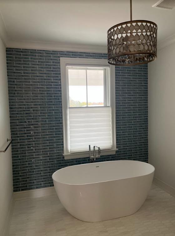 There's nothing better than a beautiful tub in a sunny window-except, of course, adding some privacy! That's exactly what we did in this Phillipsburg bathroom with our Hunter Douglas Solera Shades!