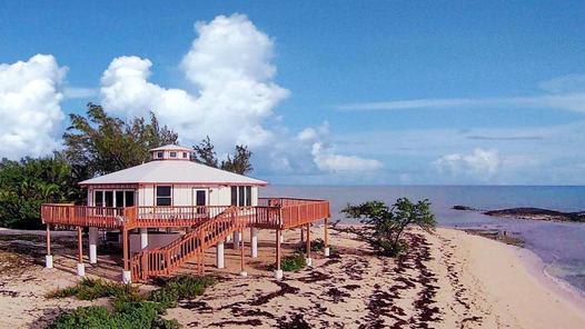 Built on an oceanfront point on North Andros in the Bahamas, this piling home was designed and engineered to be low-maintenacne and hurricane resistant.