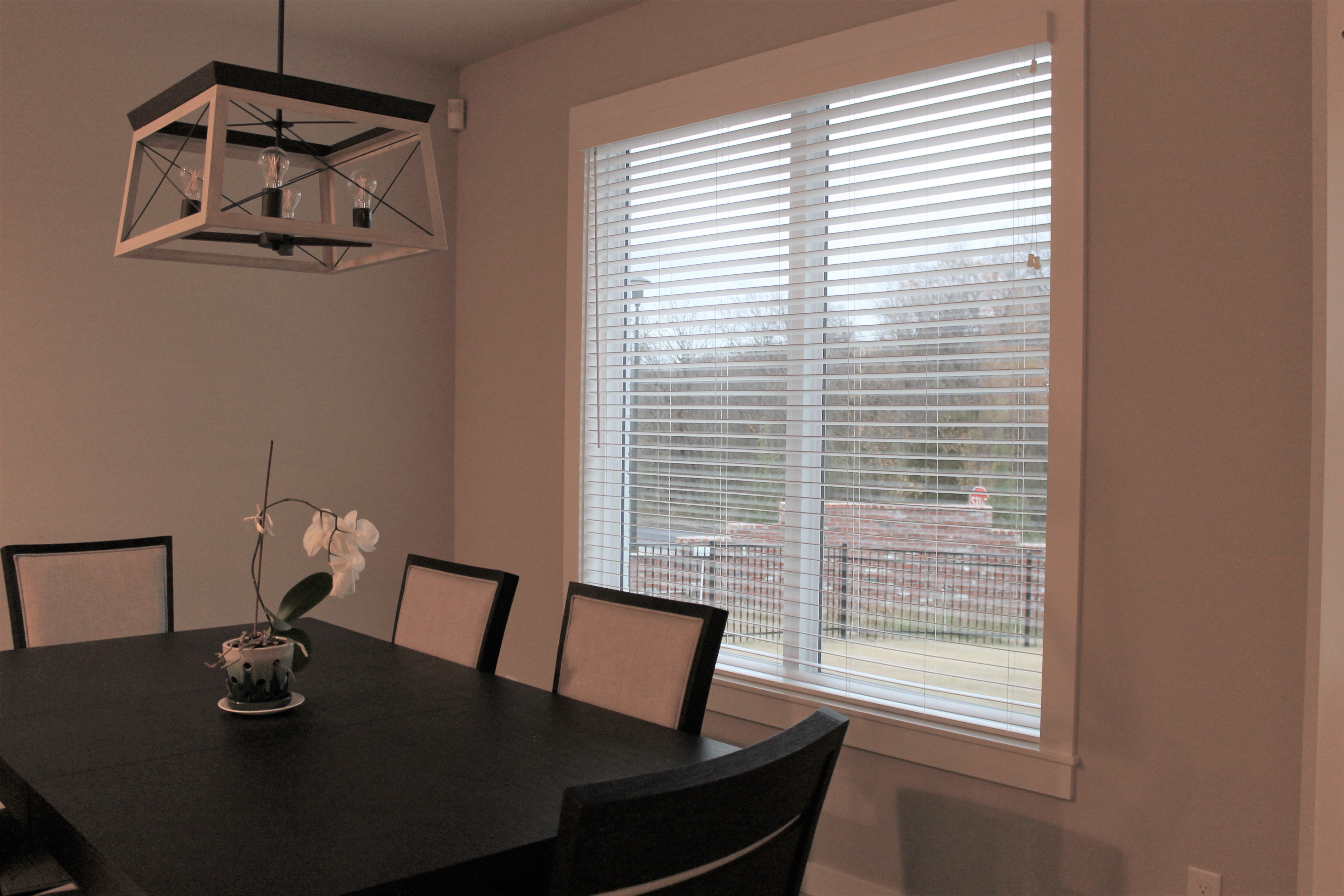 From the top of the line to more affordable builder-grade options, Budget Blinds of Owasso is here to help you with your window treatment needs! These Faux wood blinds provide privacy and they are a great light filtering option as well. Call us at (918) 376-3503 for your free in-home consultation