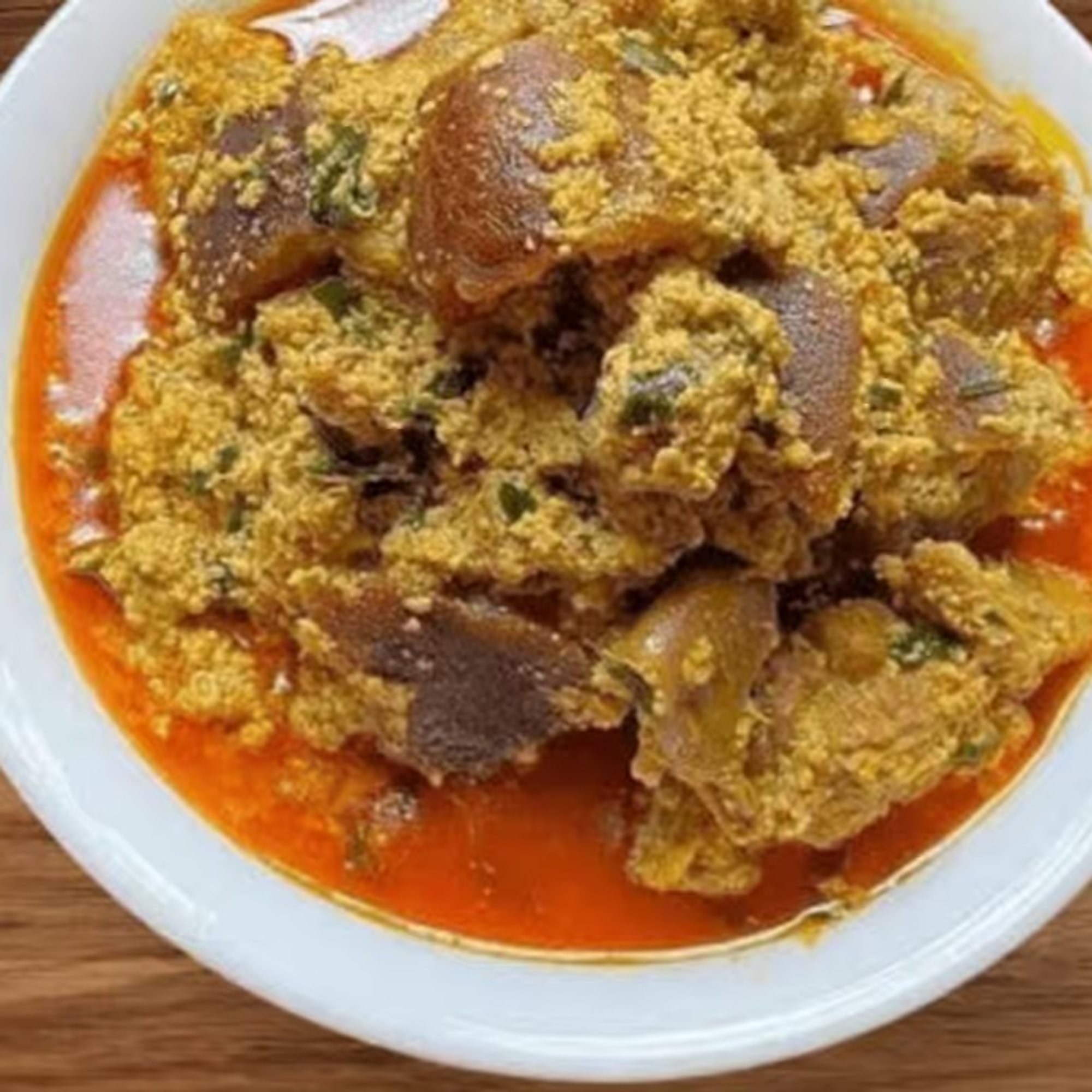 Egusi Soup with Pounded Yam, Garri, White Yam, or White Rice