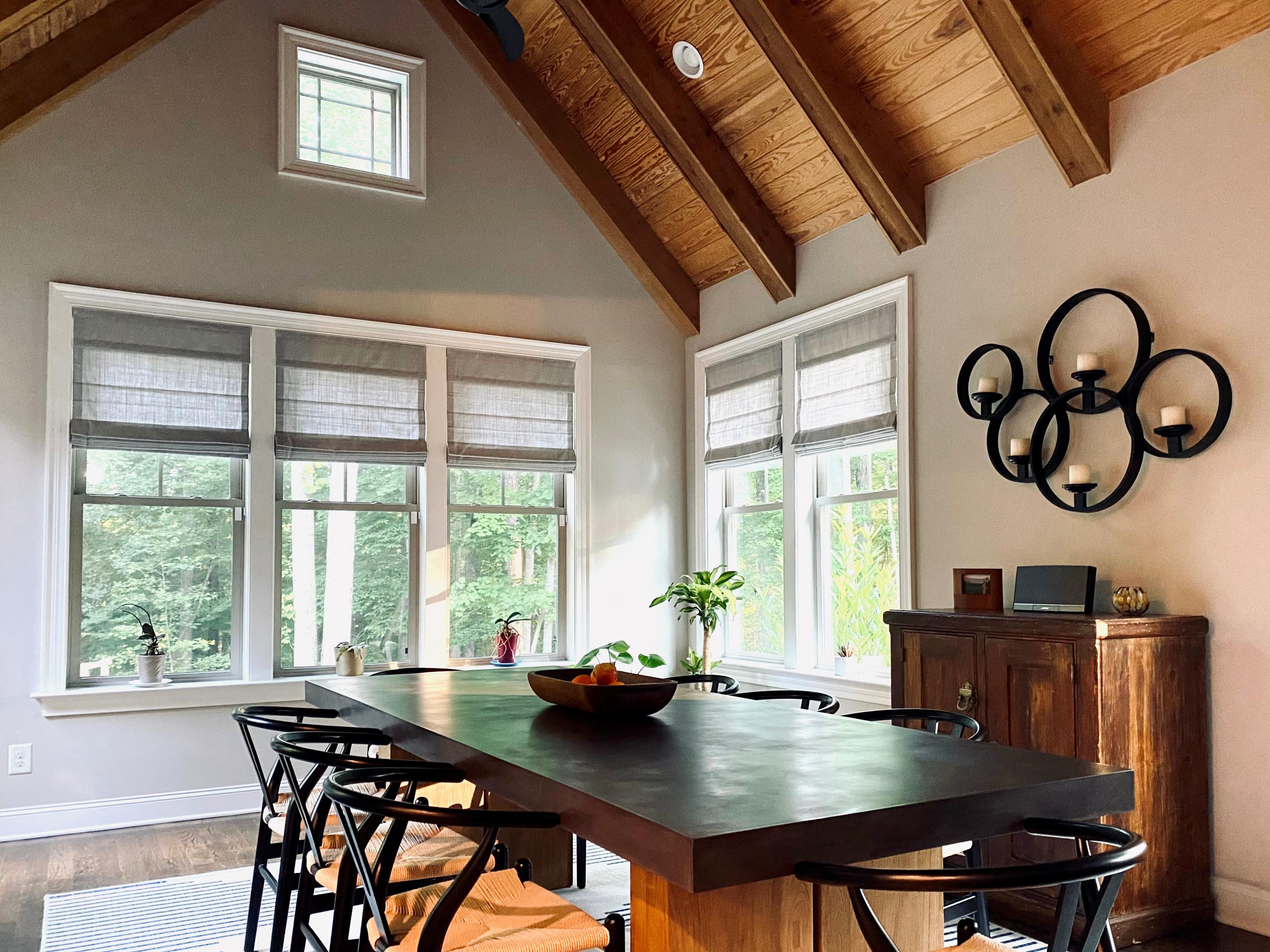 We love how this local installation turned out! These sheer grey roman shades create a beautifully bright ambiance in this Chapel Hill dining space. They allow plenty of soft light to filter through, while offering privacy and heat protection when needed.