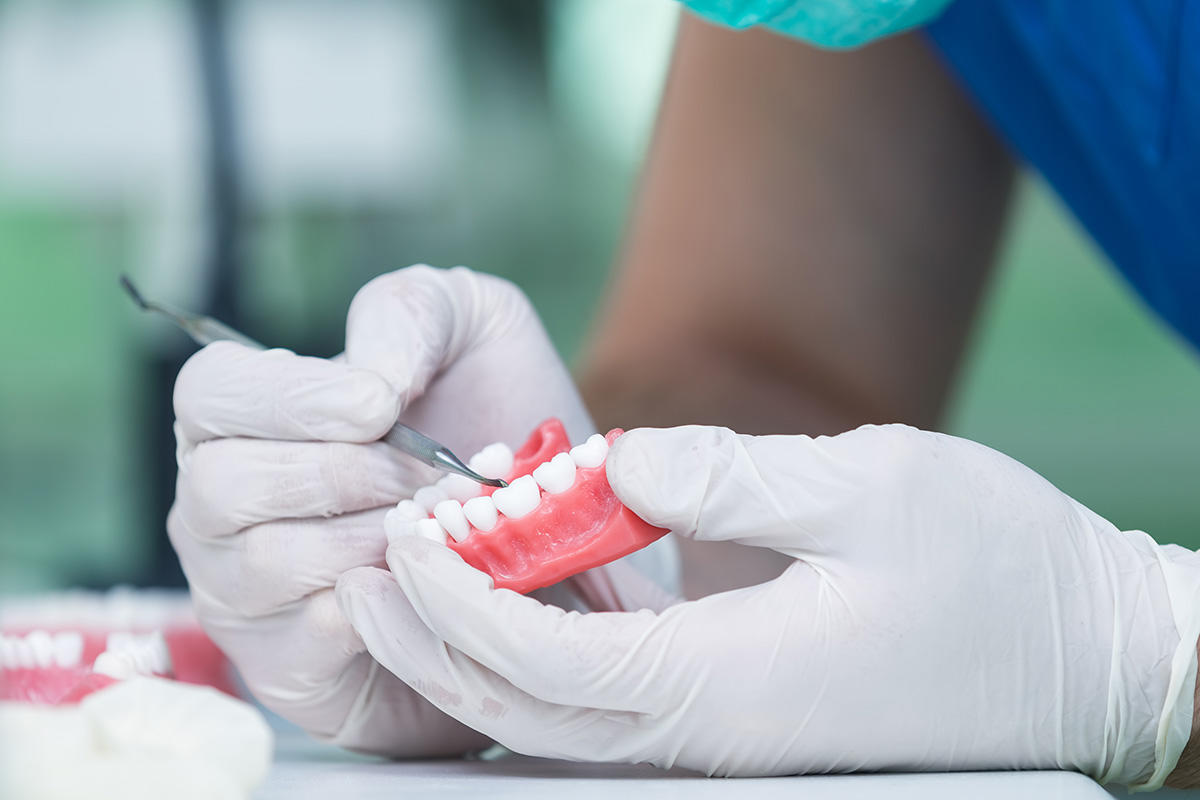 Robert M. Adornetto DDS Inc. Logo