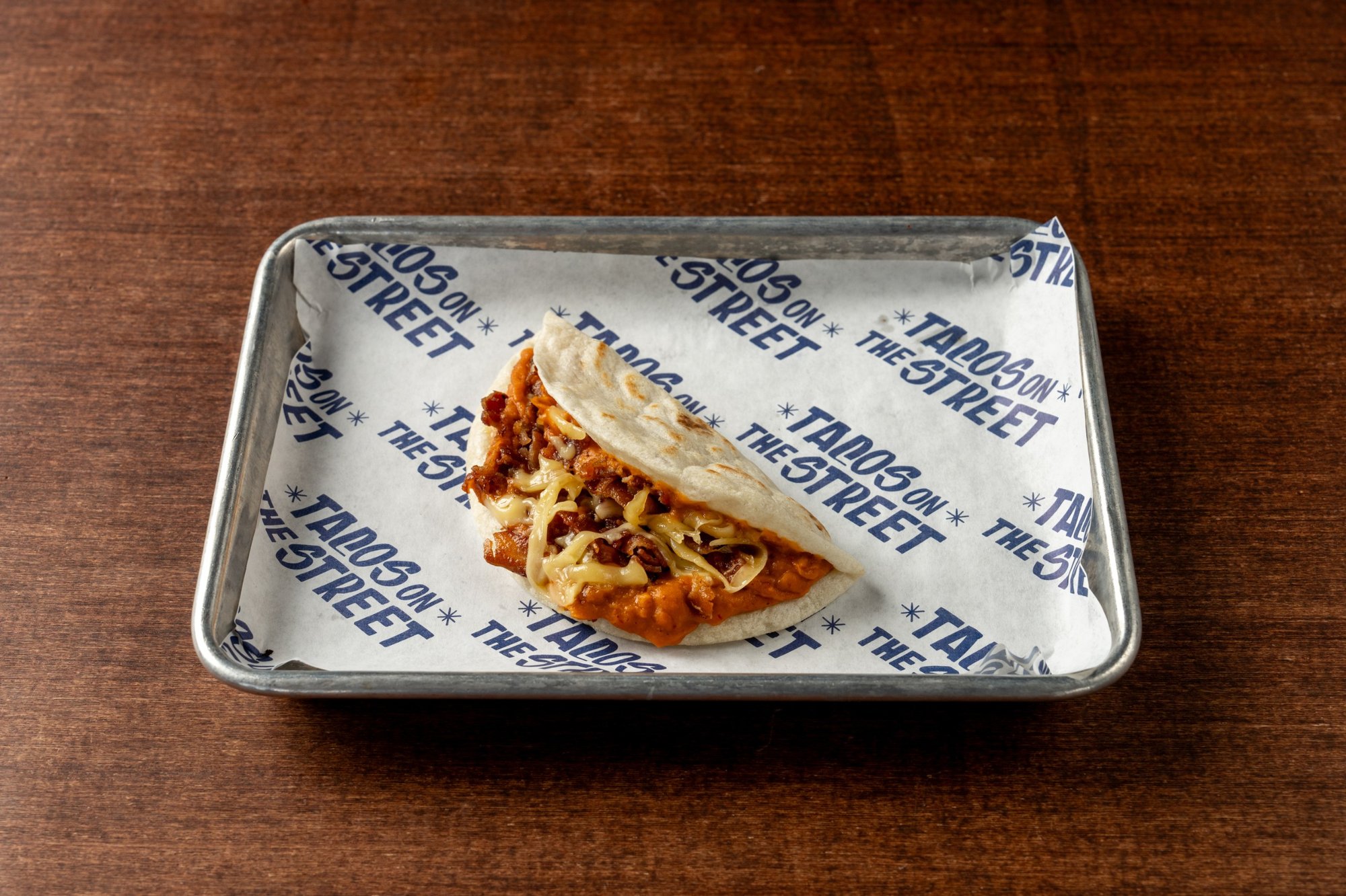 Bean, Bacon and Cheese Breakfast Taco.