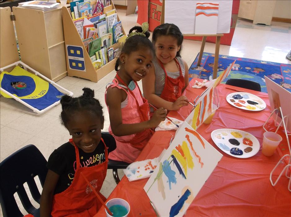 Our students enjoy Painting and Popcorn during our summer camp.