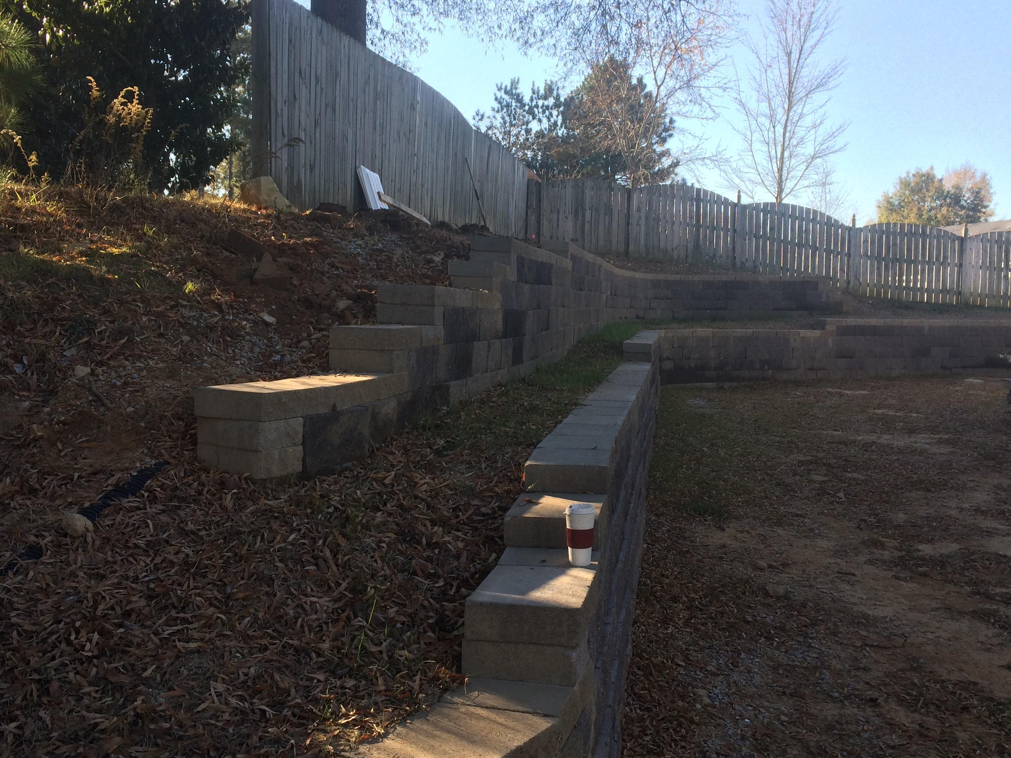 Failing retaining wall Hurley Property Services was contracted to repair and rebuild.  Walls are too close together; height of both walls determine distance b/t