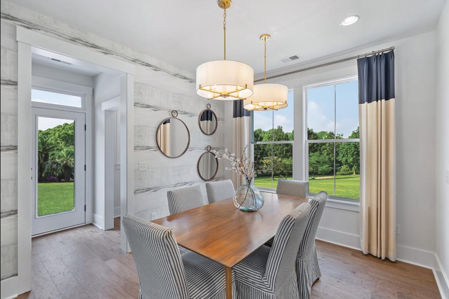 Casual dining areas adjacent to the kitchen with ample natural light