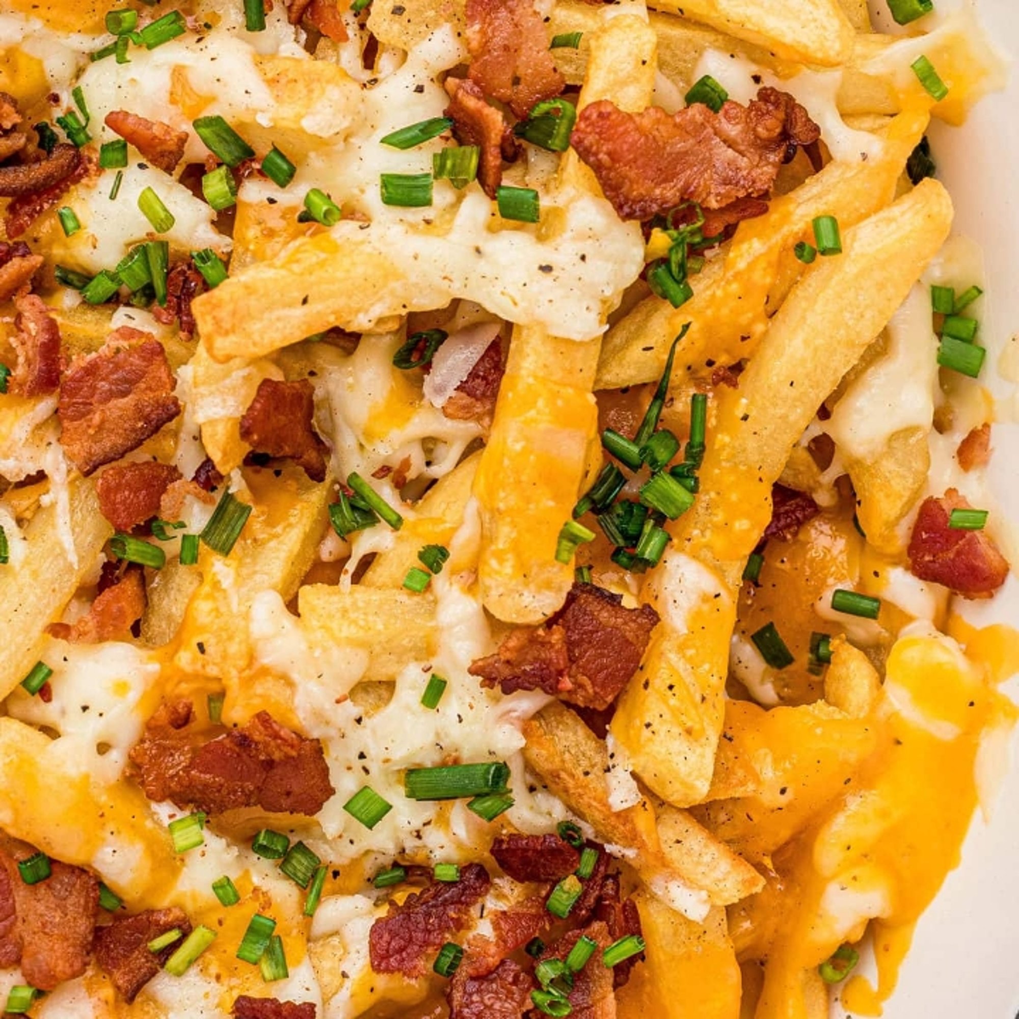 LOADED FRIES our delicious crisp, coated fries piled high with mozzarella cheese, cheese sauce &...