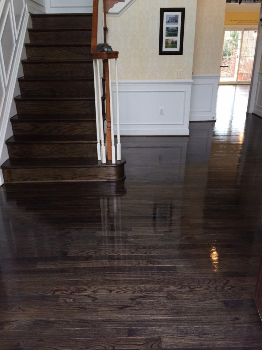 Refinish job in rockville MD, 2000 sqft home, going from gunstock color to ebony color with waterbased streetshoe.