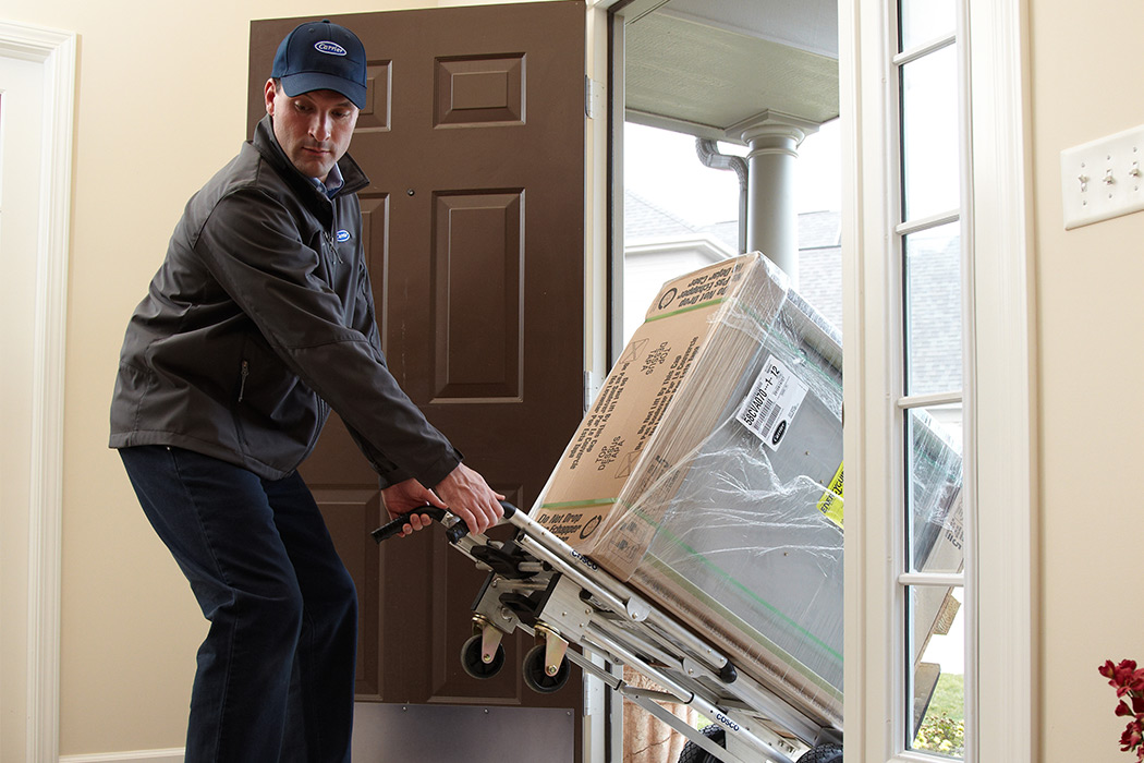 A Carrier dealer finishes performing HVAC installation