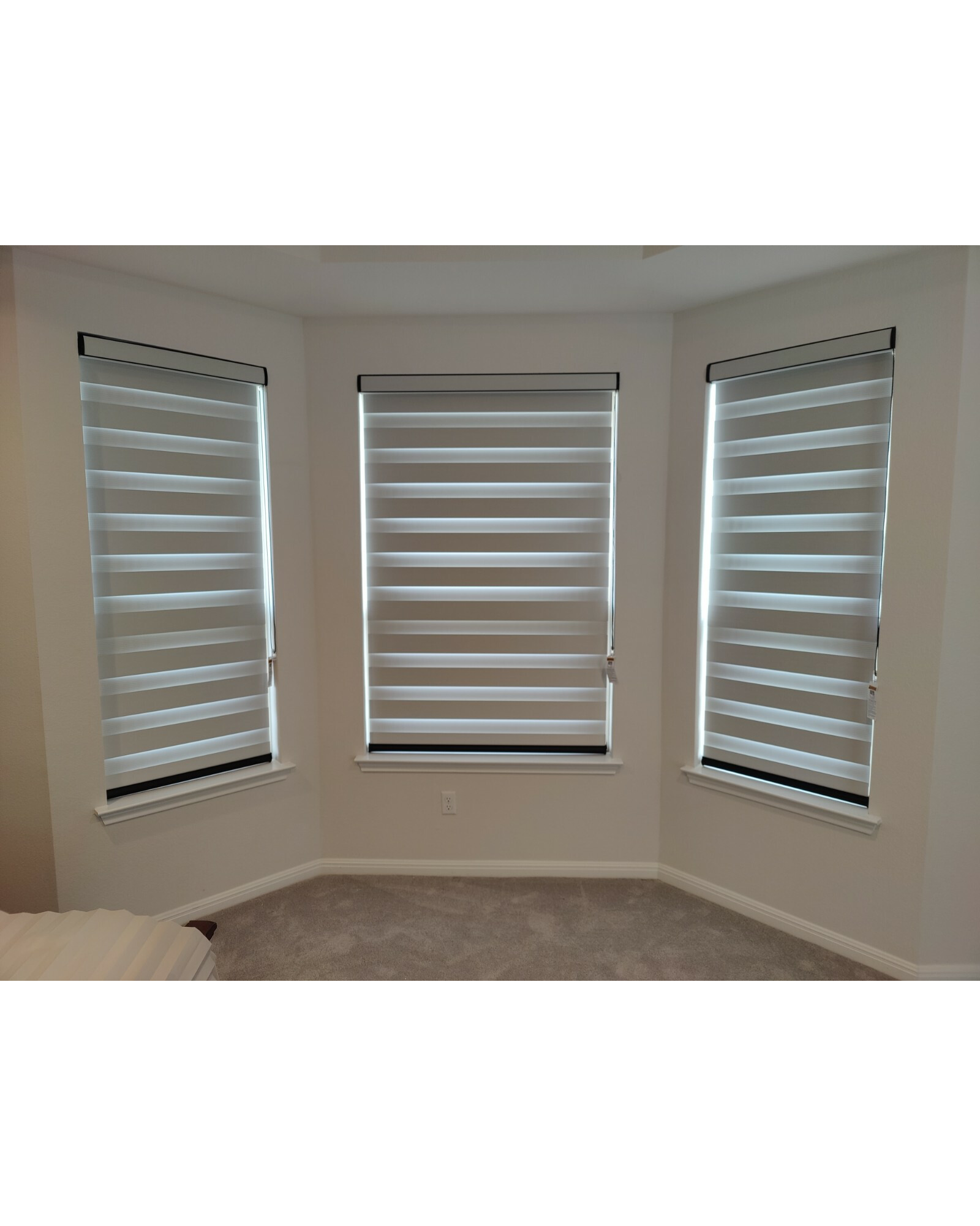 Dual sheer roller shade with black cassette and bottom rail for master bedroom in Leander