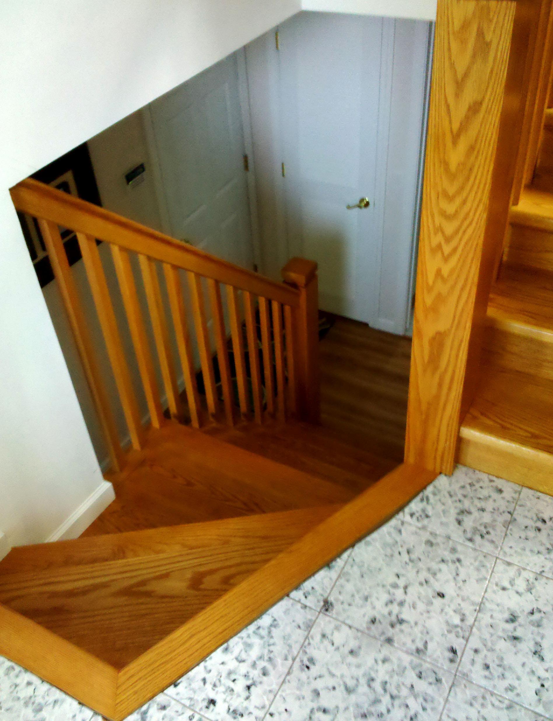 New stairway to refinished basement including new flooring & doors.