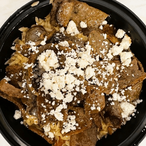 Seven Slices of Gyro Meat Over Orzo with Feta