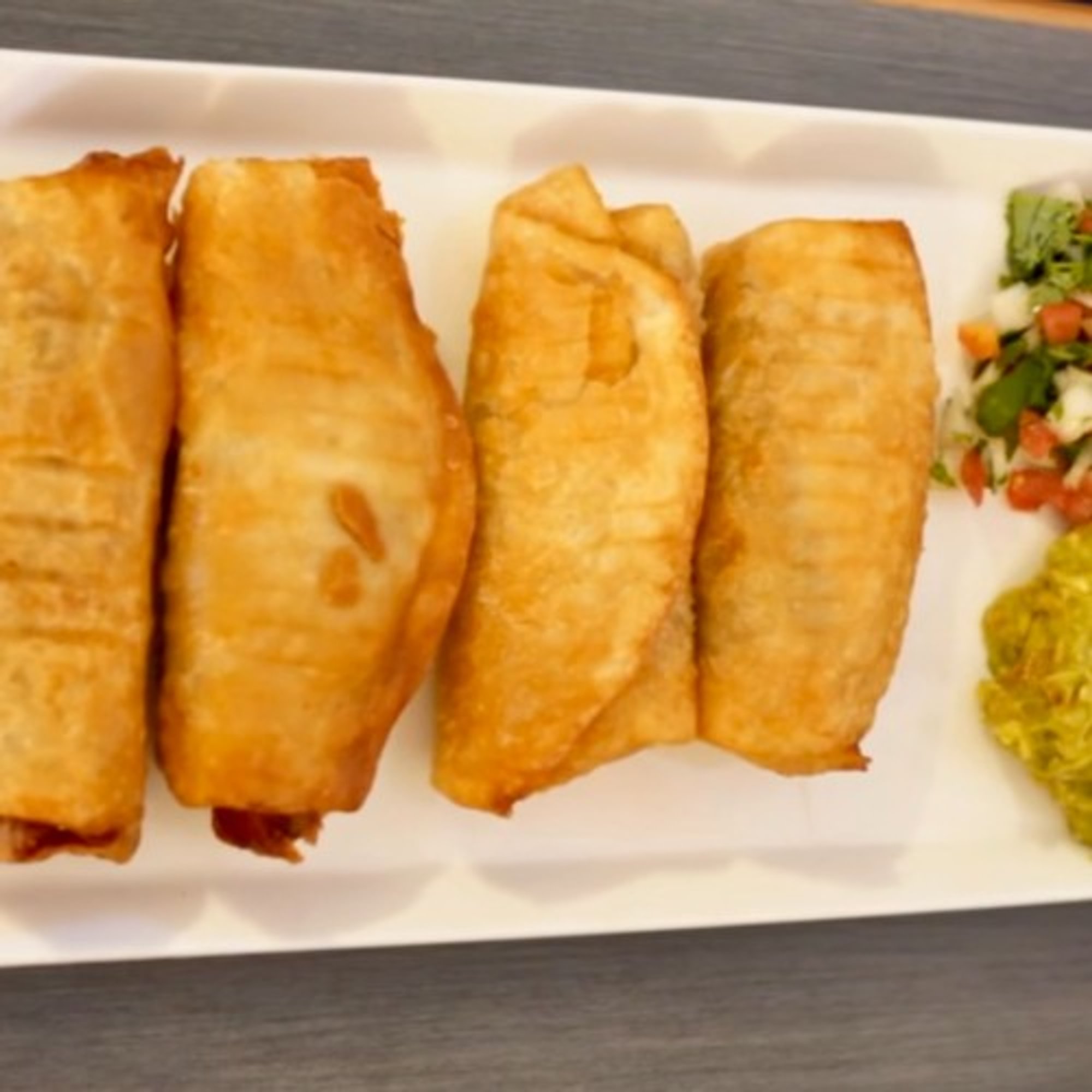 4 Mini Chimichangas served with guacamole and pico de gallo