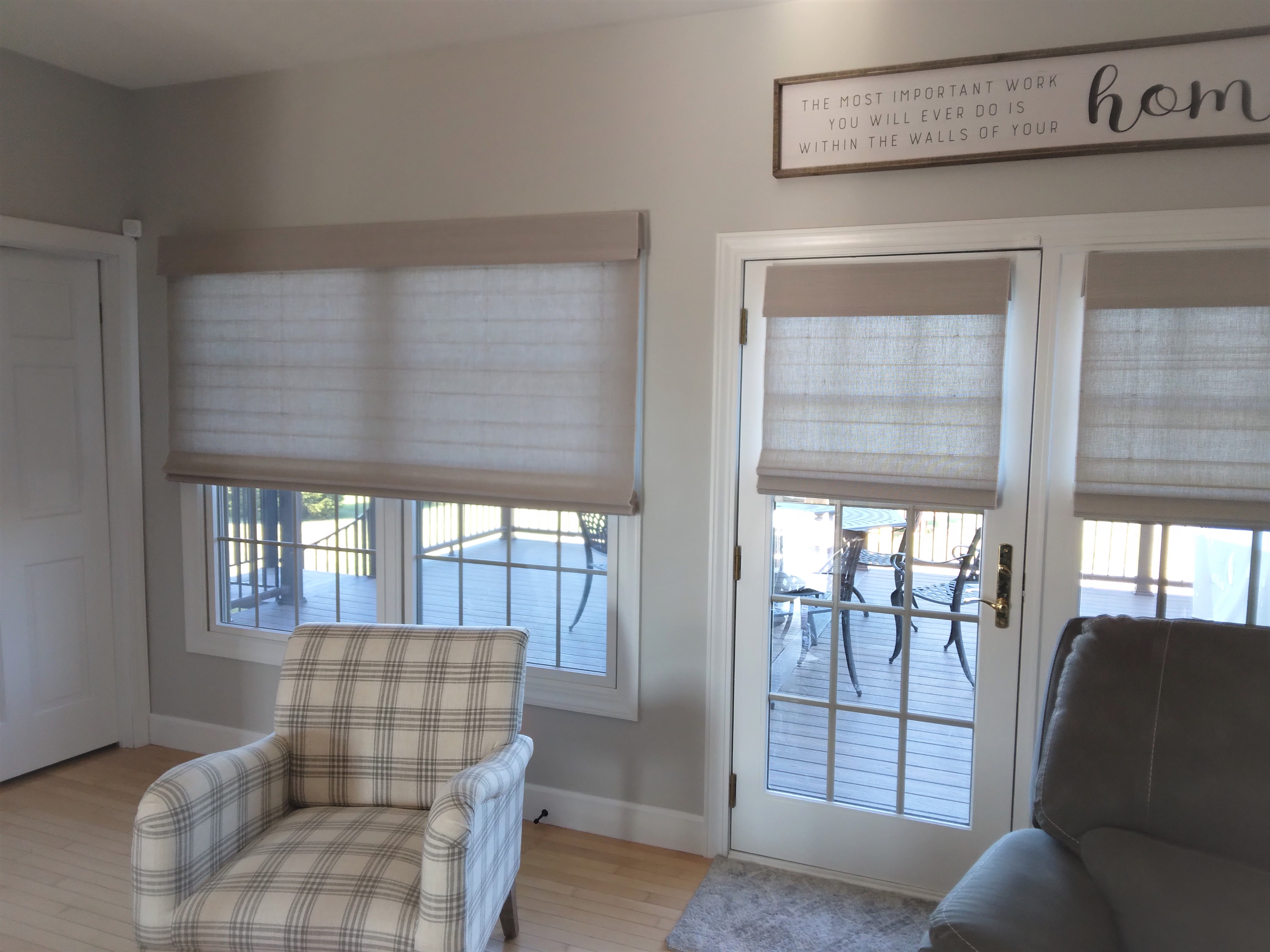 Light filtering natural shades in Springfield Illinois living room.  BudgetBlinds  WindowCoverings  NaturalShades  WovenWoodShades  SpringfieldIllinois