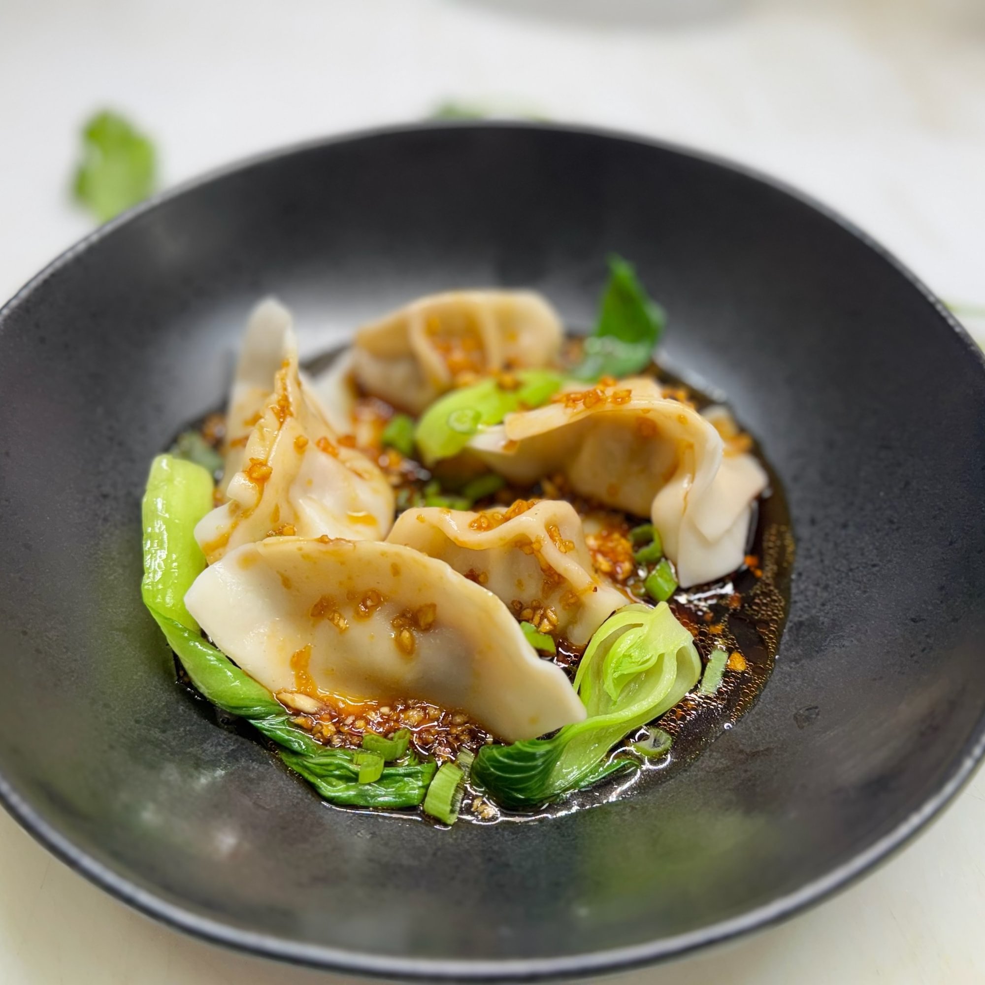 Handmade Dumplings In Spicy Garlic Sauce