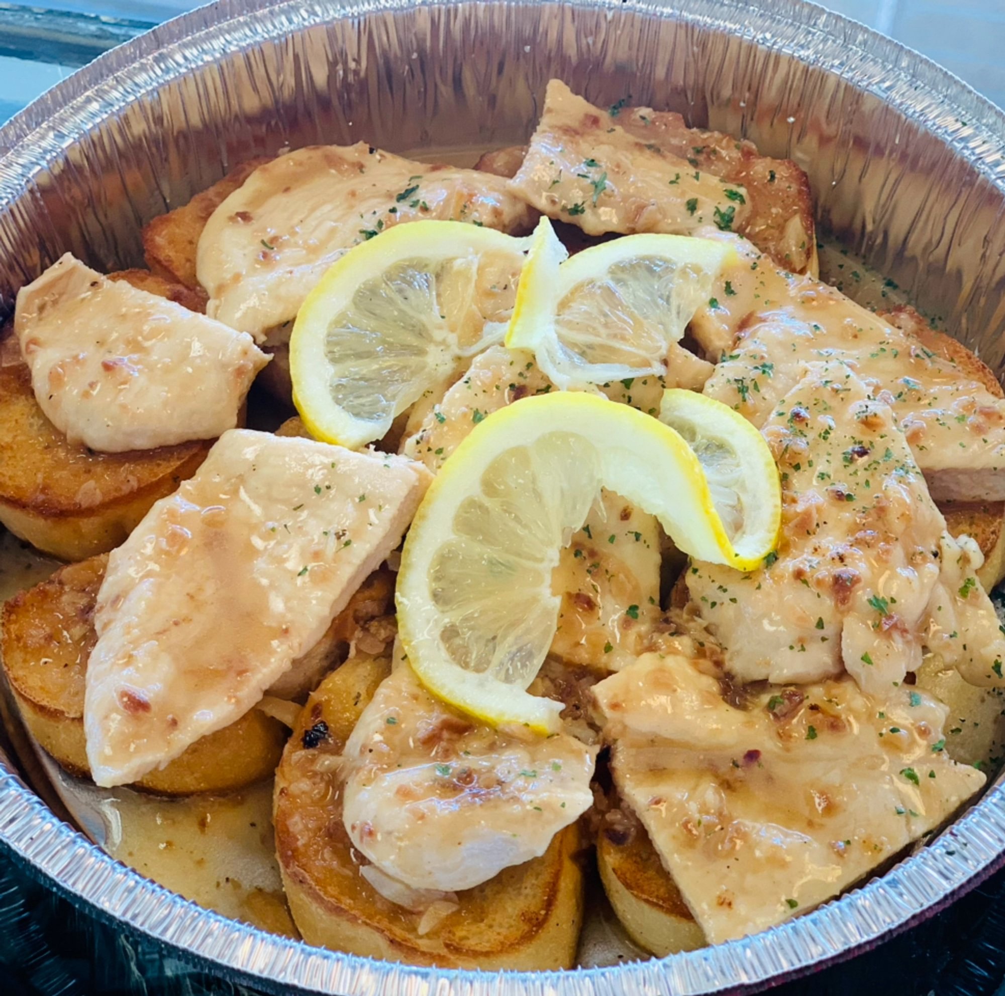 Chicken Scampi Over Garlic Bread