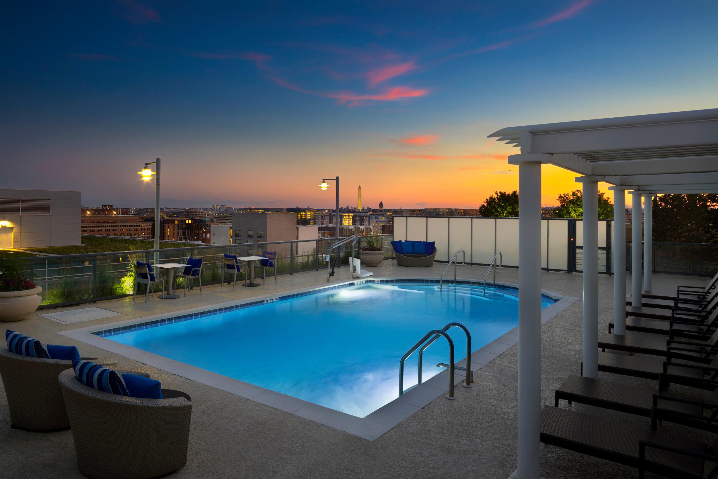 Camden NoMa apartments in Washington D.C. rooftop pool at sunset.