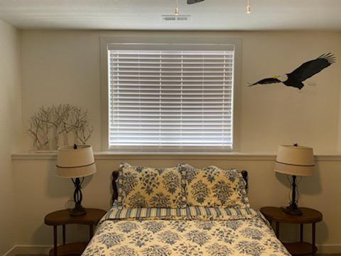 Here's a cozy bedroom from Cedar Falls! It's great having a window above the bed-except for those times the morning sun stops you from sleeping in. Our solution? Aluminum Blinds!  BudgetBlindsCedarFallsWaterloo  FreeConsultation  AluminumBlinds