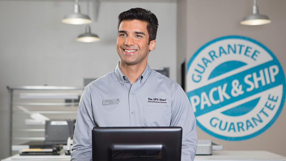 Smiling associate behind the counter