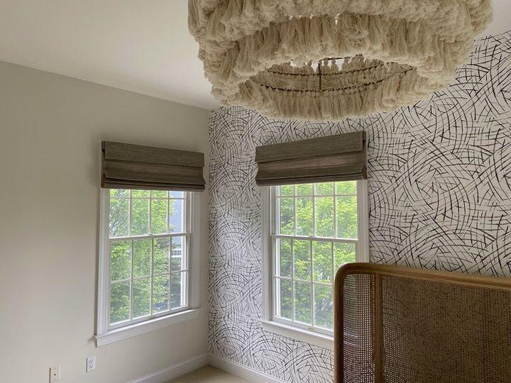 Our woven Roman Shades look right at home in this modern, rustic bedroom in Oxford, NJ! Rattan, wood, and warm tones are the craze at the minute - and our shades fit right into the deÌcor.  BudgetBlindsPhillipsburg  FreeConsultation  RomanShades  OxfordNJ