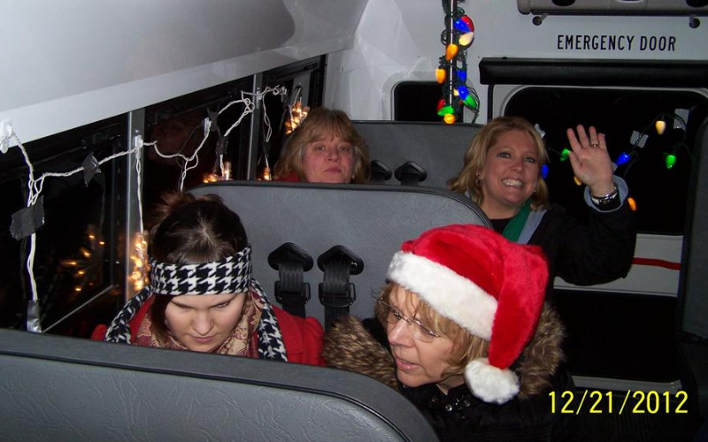 Our teachers having fun driving to our families homes to sing!