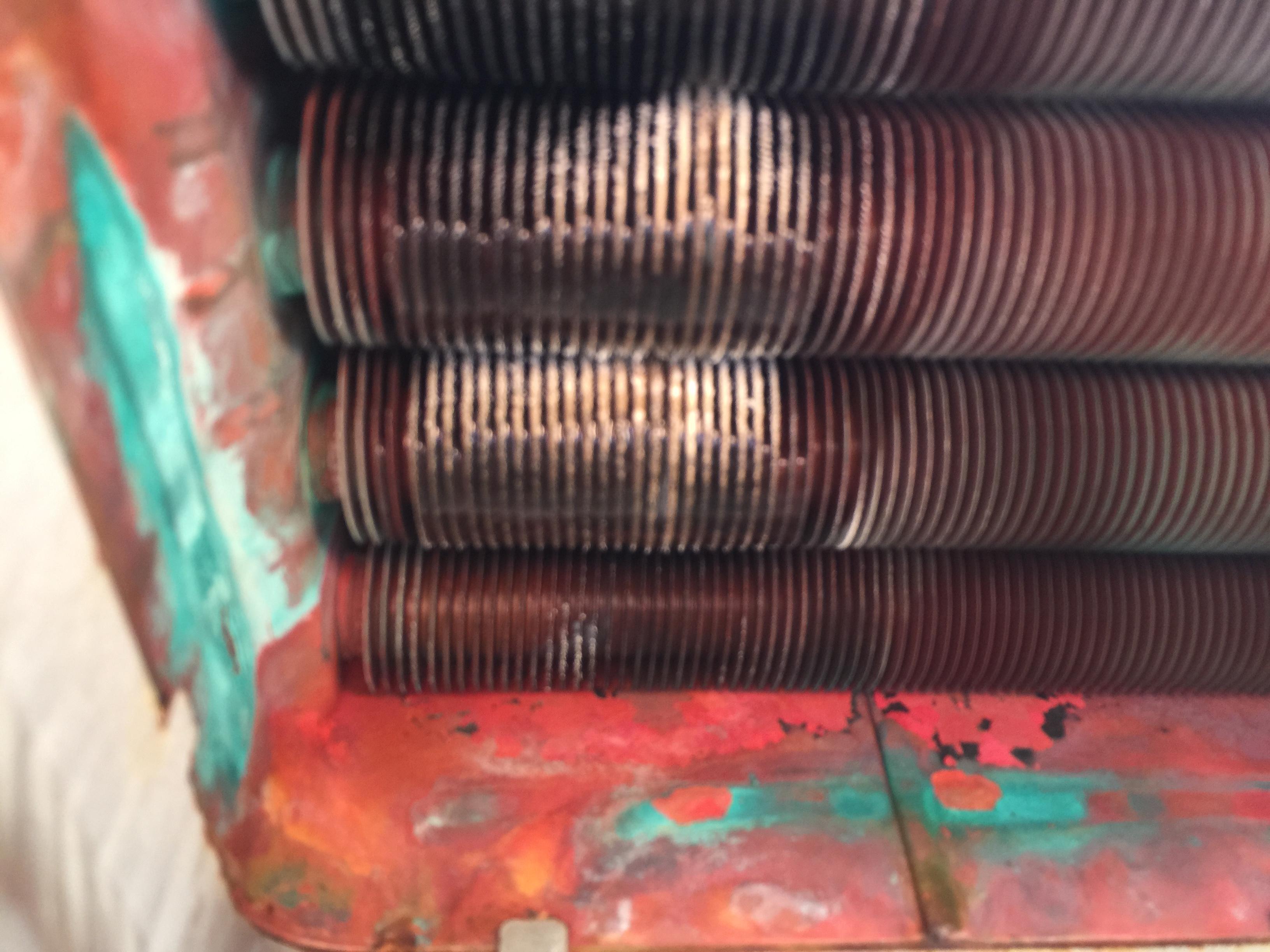 Replace heat exchanger from takagi tankless water heater, and maintenance burner and gas manifold