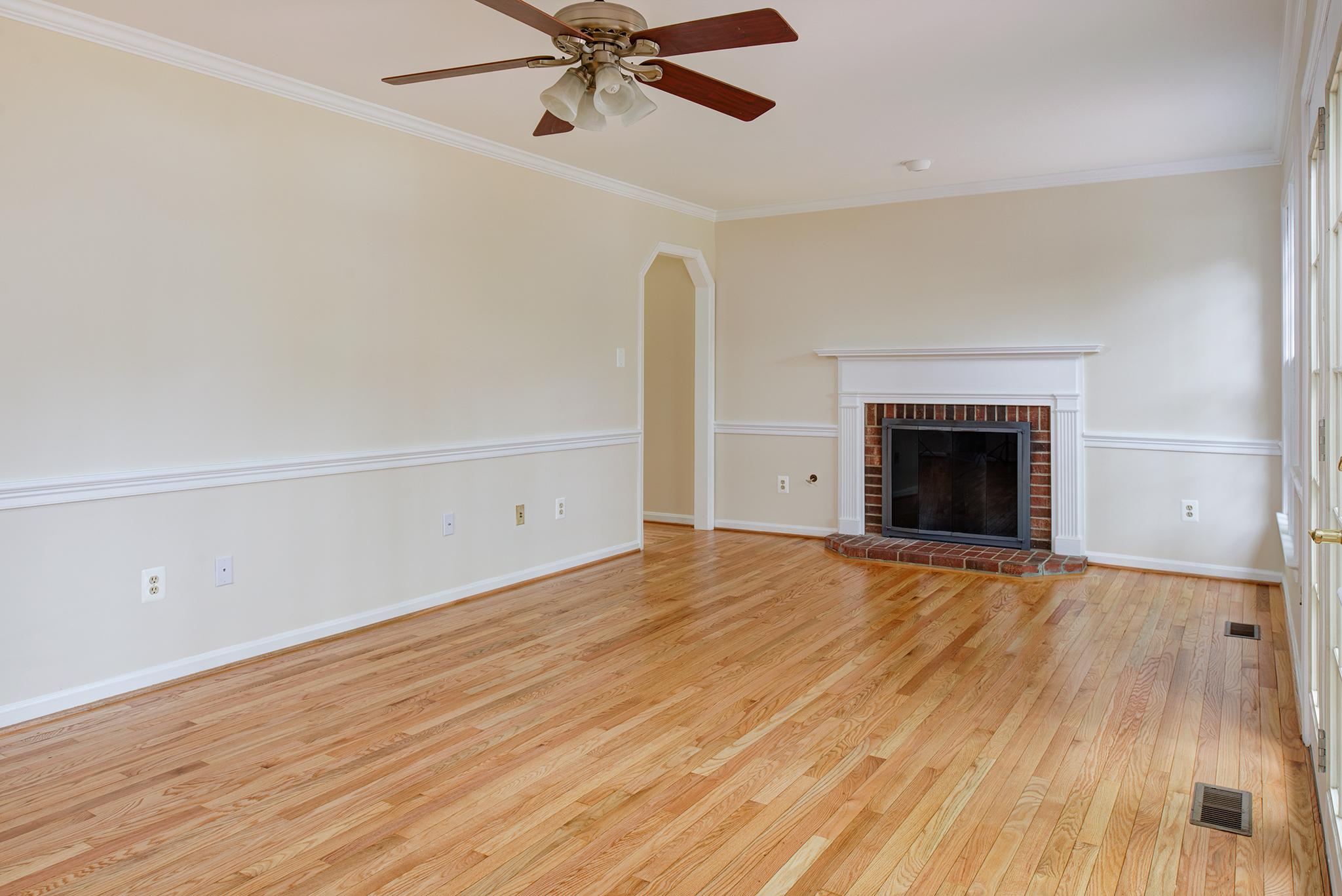 This is the wonderfully spacious living room of 1635 Stowe Rd. before we placed any furniture. Potential buyers were struggling with how to use the space.