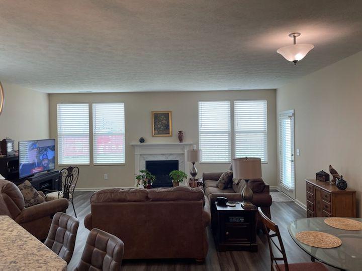 Check out this Plainfield living space! It looks so clean and crisp, with just the right amount of natural sunlight! That's how good our Wood Blinds are for filtering light!