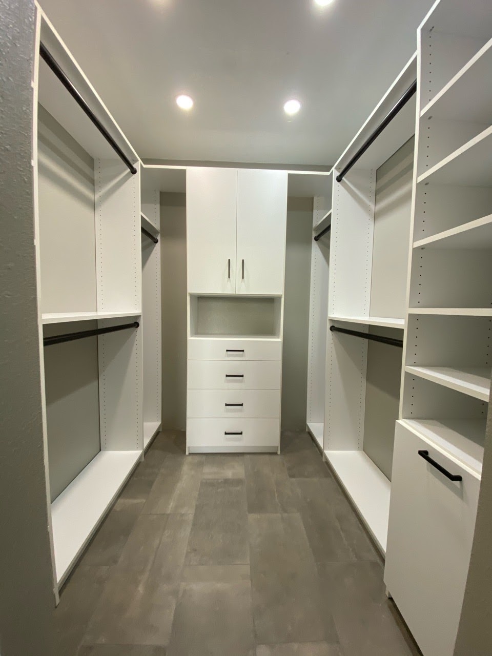 White walk-in closet w/ Oil Rubbed Bronze hardware