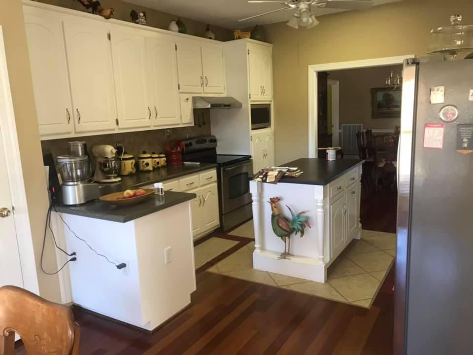 Timber &amp; Hew Home Restoration, LLC Logo