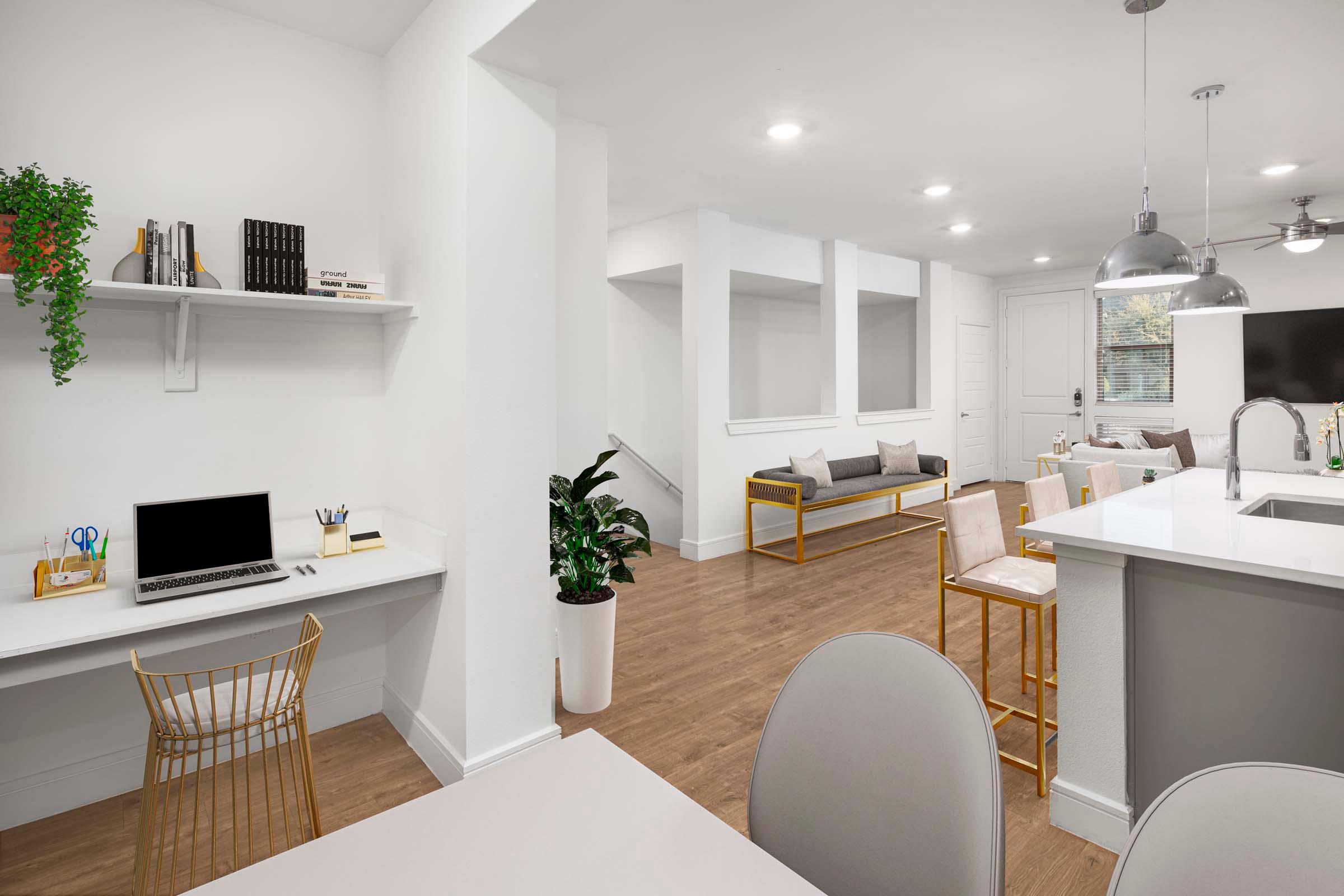 Villas townhome dining room with built-in desk and view toward the private garage stairs at Camden Greenville