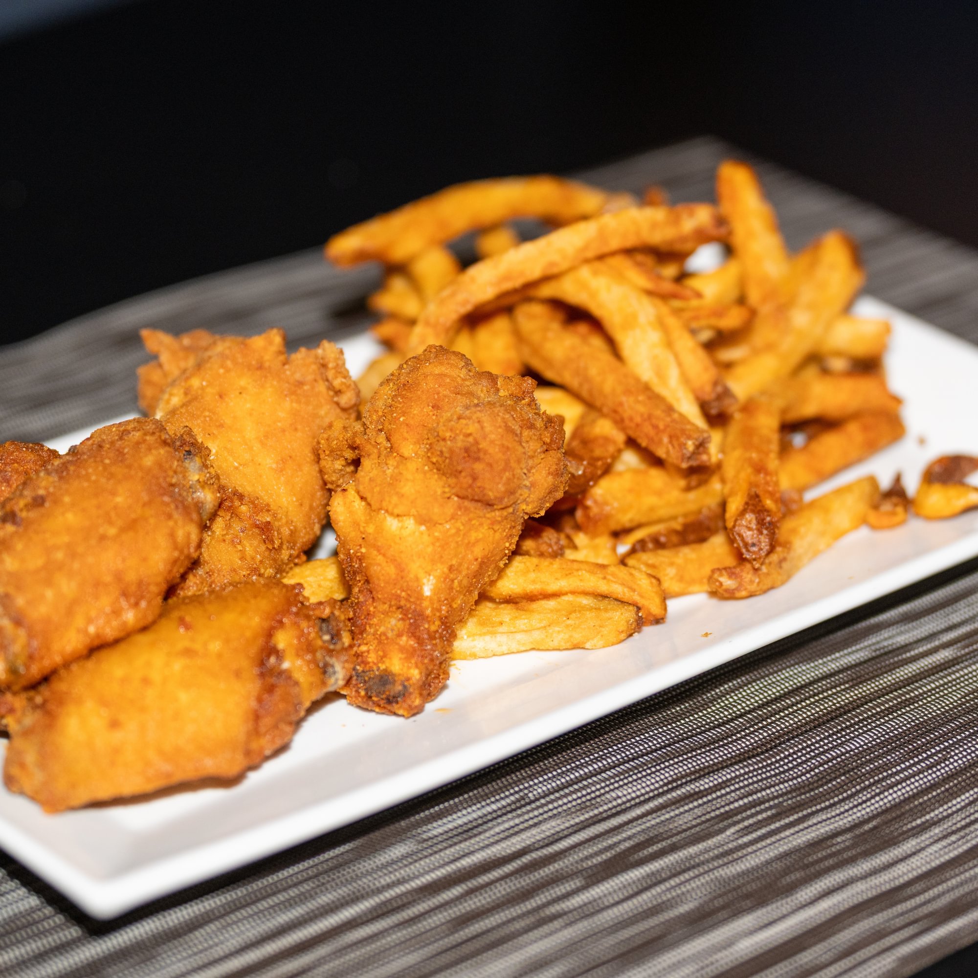 5 Wings with a side of our Seasooned hand-cut Fries (5)