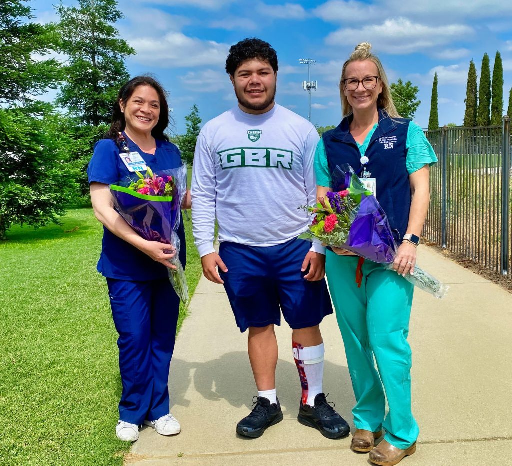 Nurses flank teen rugby player/stroke victim