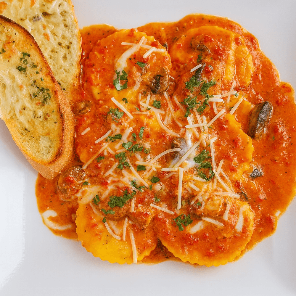 Jumbo cheese ravioli with roasted red pepper cream sauce