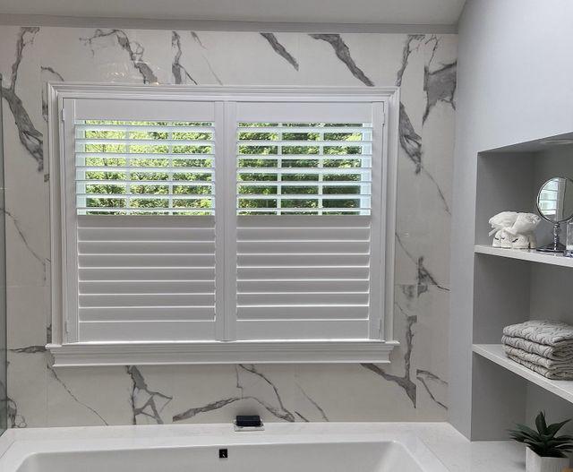 Let the light flood into your bathroom without compromising your privacy. These Composite Shutters are the perfect finishing touch to bring together this peaceful Phillipsburg, NJ bathroom.  BudgetBlindsPhillipsburg  CompositeShutters  MoistureResistantShutters  ShutterAtTheBeauty  FreeConsultation