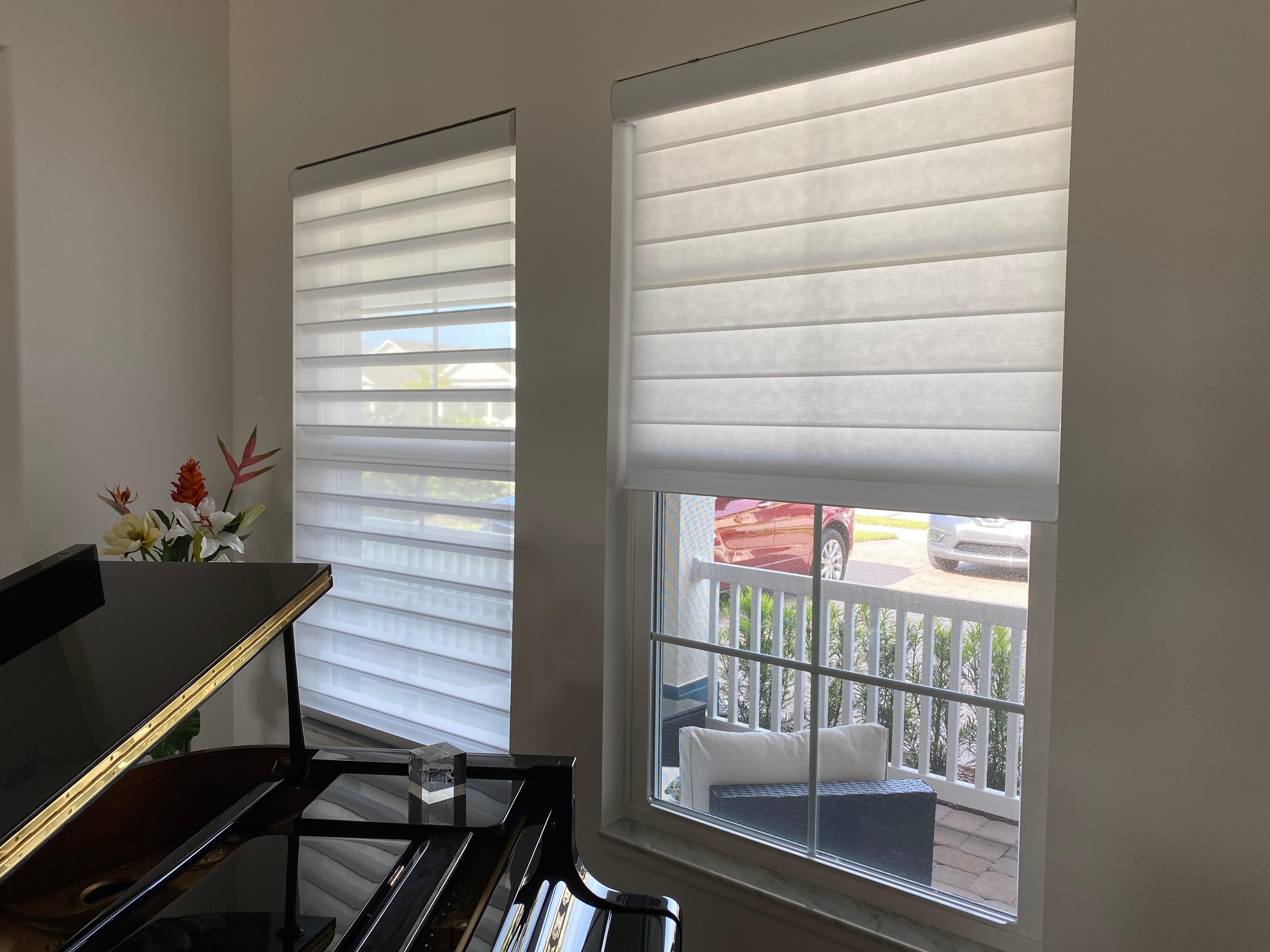 These window shadings are an eye catching way to frame this Vero Beach living space! Plus, they let lots of natural light flood in on this lovely piano.