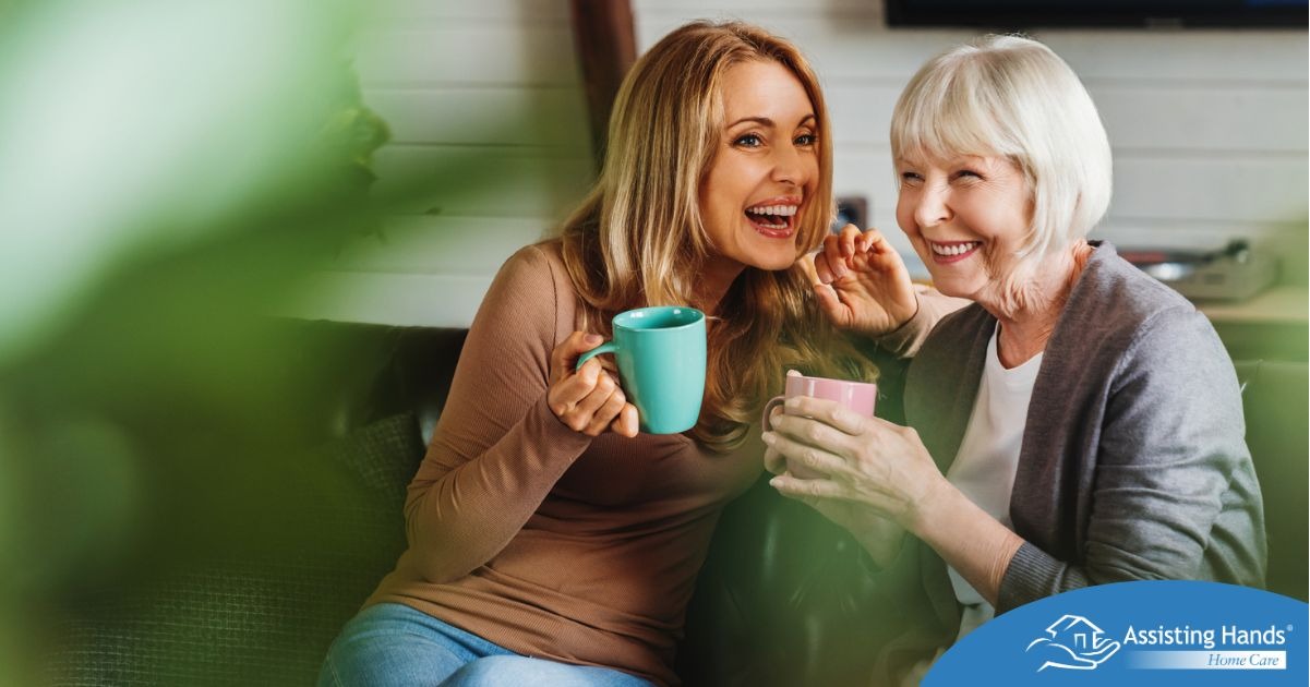 A caregiver shares a warm moment of conversation and companionship with a senior client at home. Assisting Hands Home Care in Lexington, MA focuses on building meaningful relationships that reduce loneliness and bring comfort, trust, and joy to everyday life.